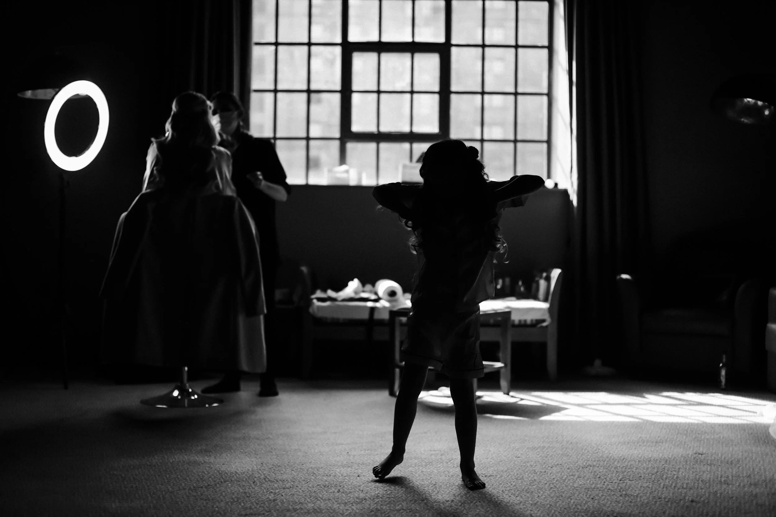 Morning Celebration: Silhouette of a Young Girl Dancing in the Titanic Hotel Room on the Wedding Day, Adding a Playful and Joyful Element to the Preparations.