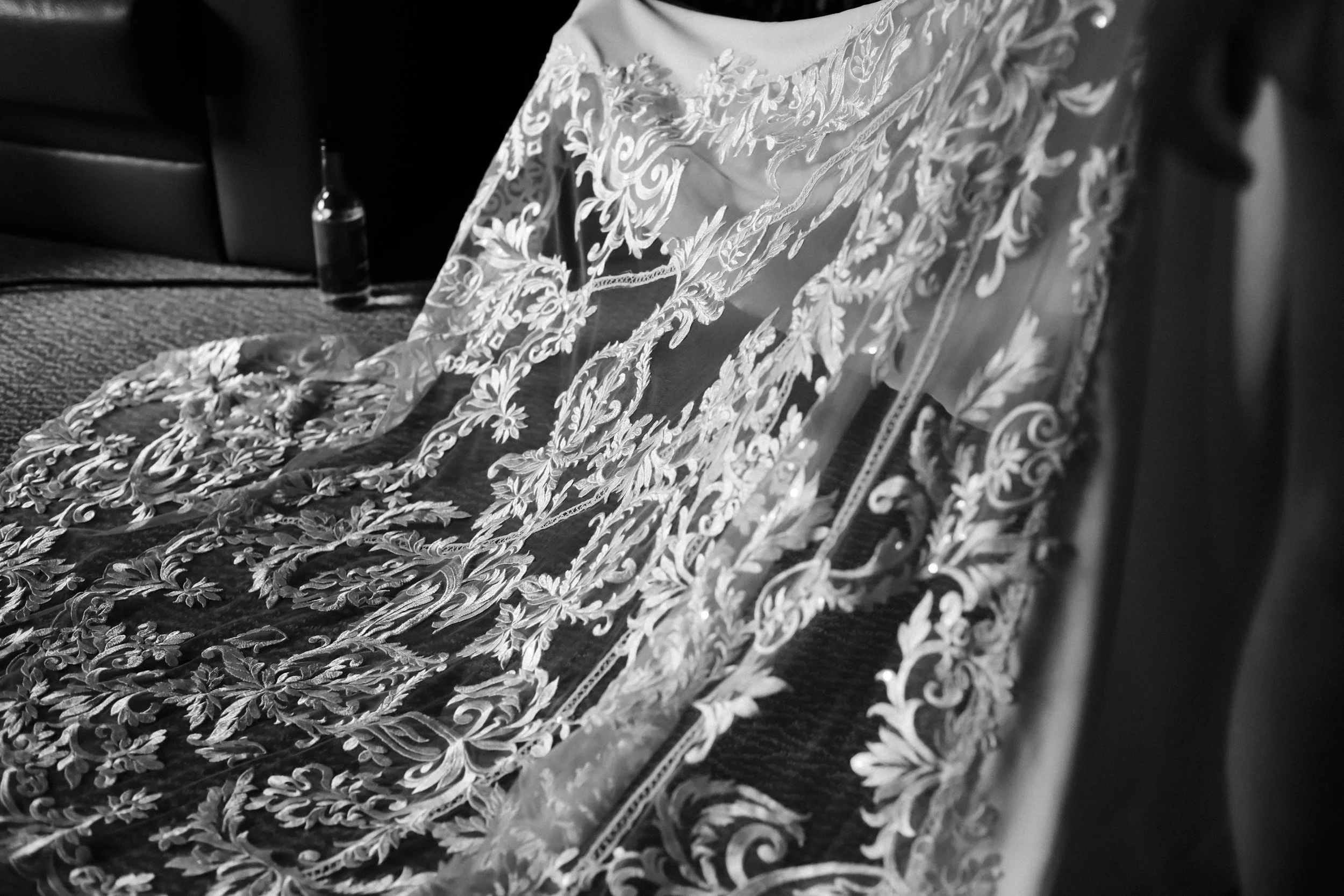 Lace Elegance: Veil Spread Out, Revealing All the Intricate Lace Details in a Stunning Showcase of Bridal Beauty.