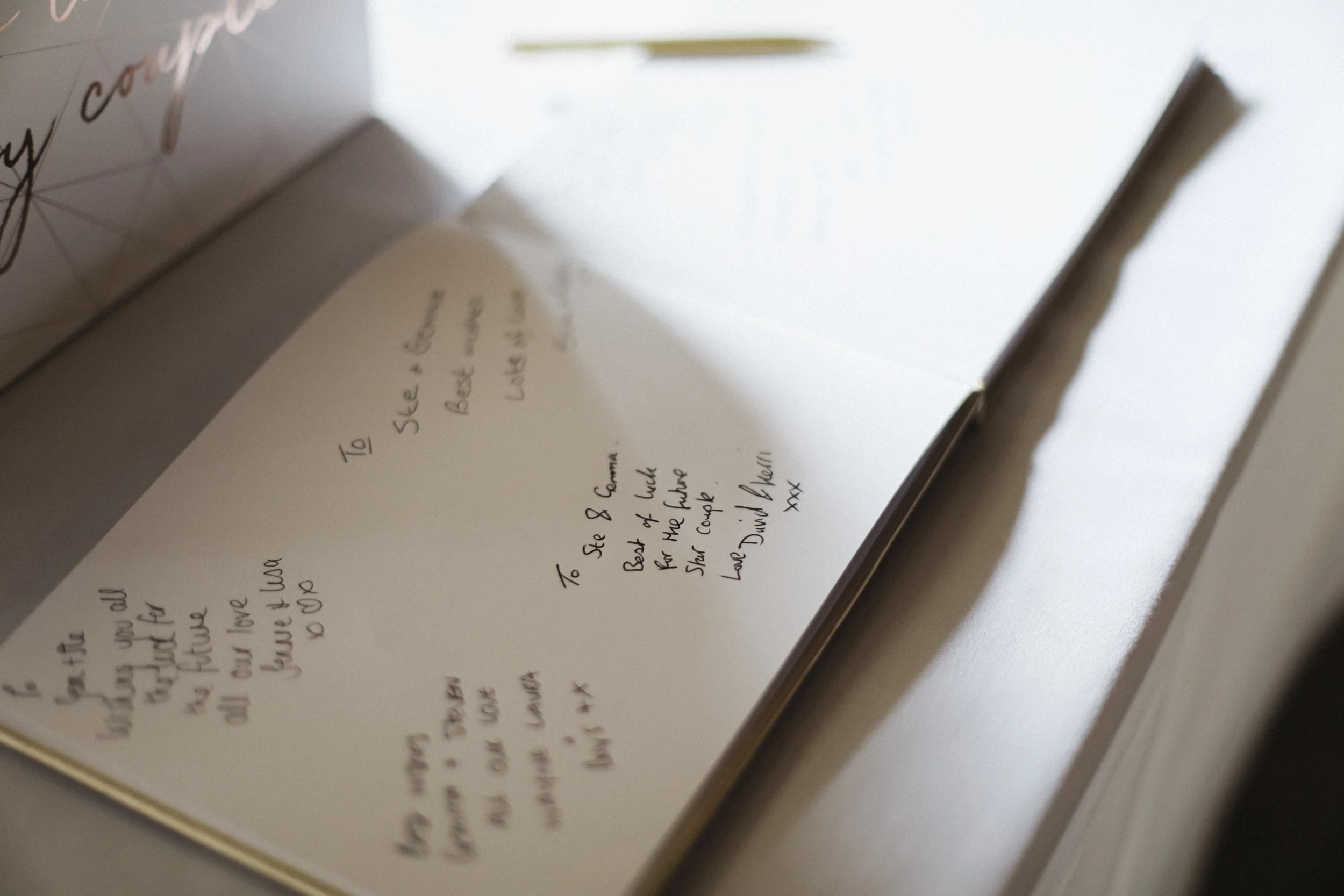 Guest Book Filled with Heartfelt Best Wishes and Warm Messages from Loved Ones, Creating a Beautiful Keepsake of the Special Day's Memories.