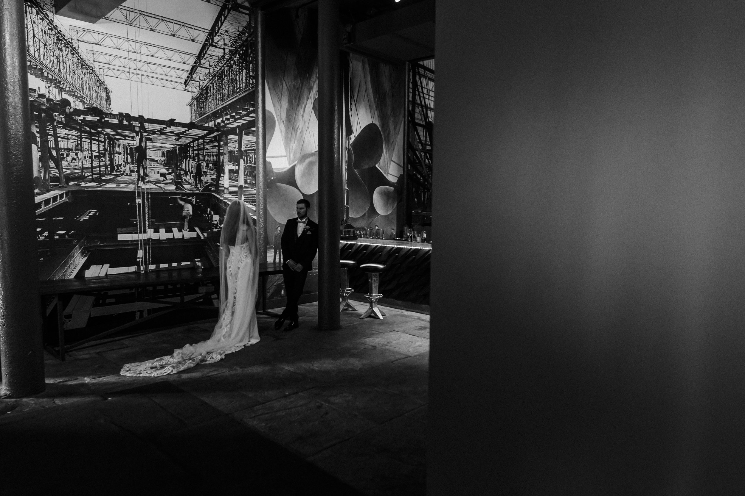 Anticipation and Excitement: Bride and Groom Eagerly Await to Be Seated for Their Wedding Breakfast, Embracing the Joyful Moments of the Day.