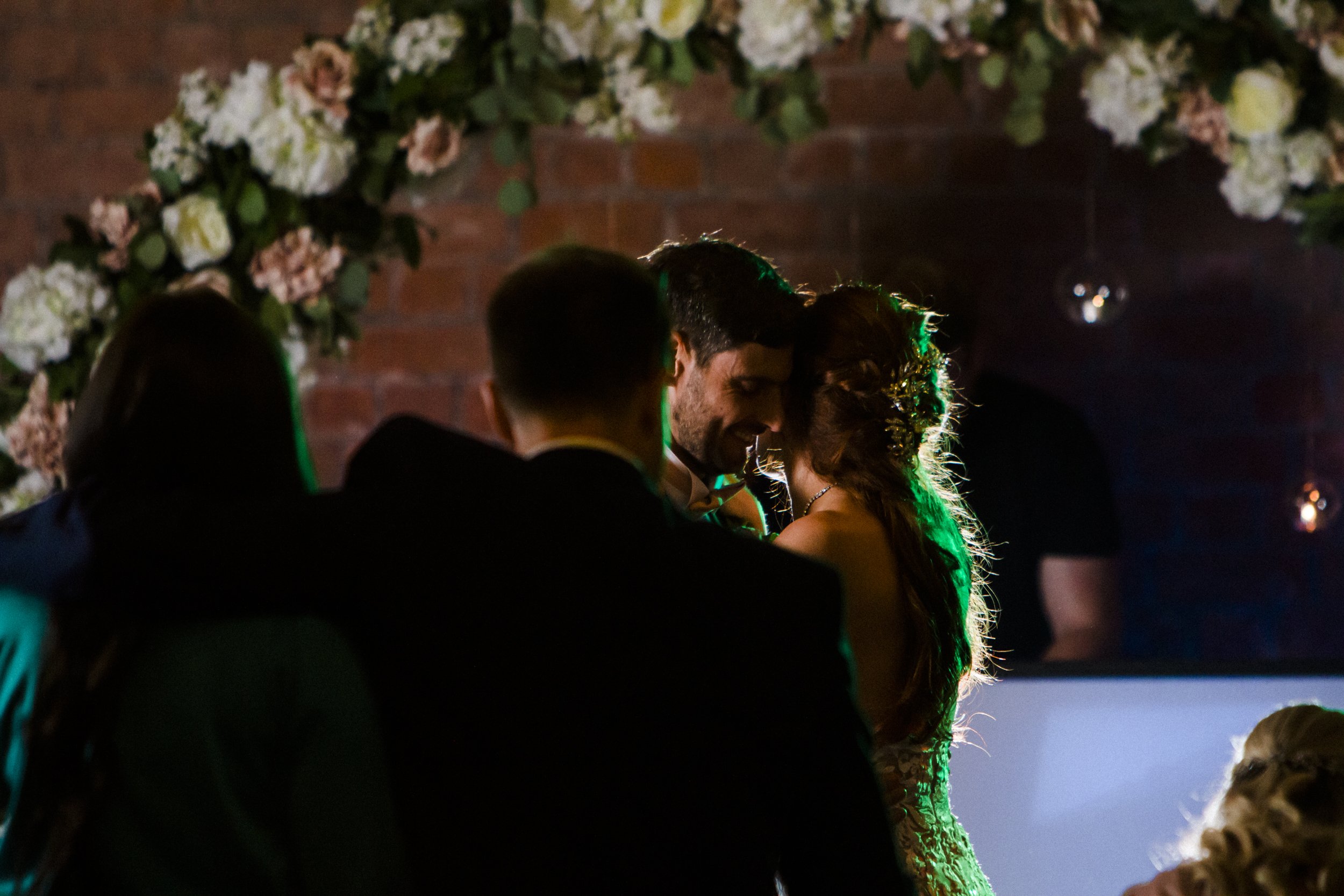 In a Tender Embrace: Bride and Groom Share a Close and Intimate First Dance at Titanic Hotel Liverpool