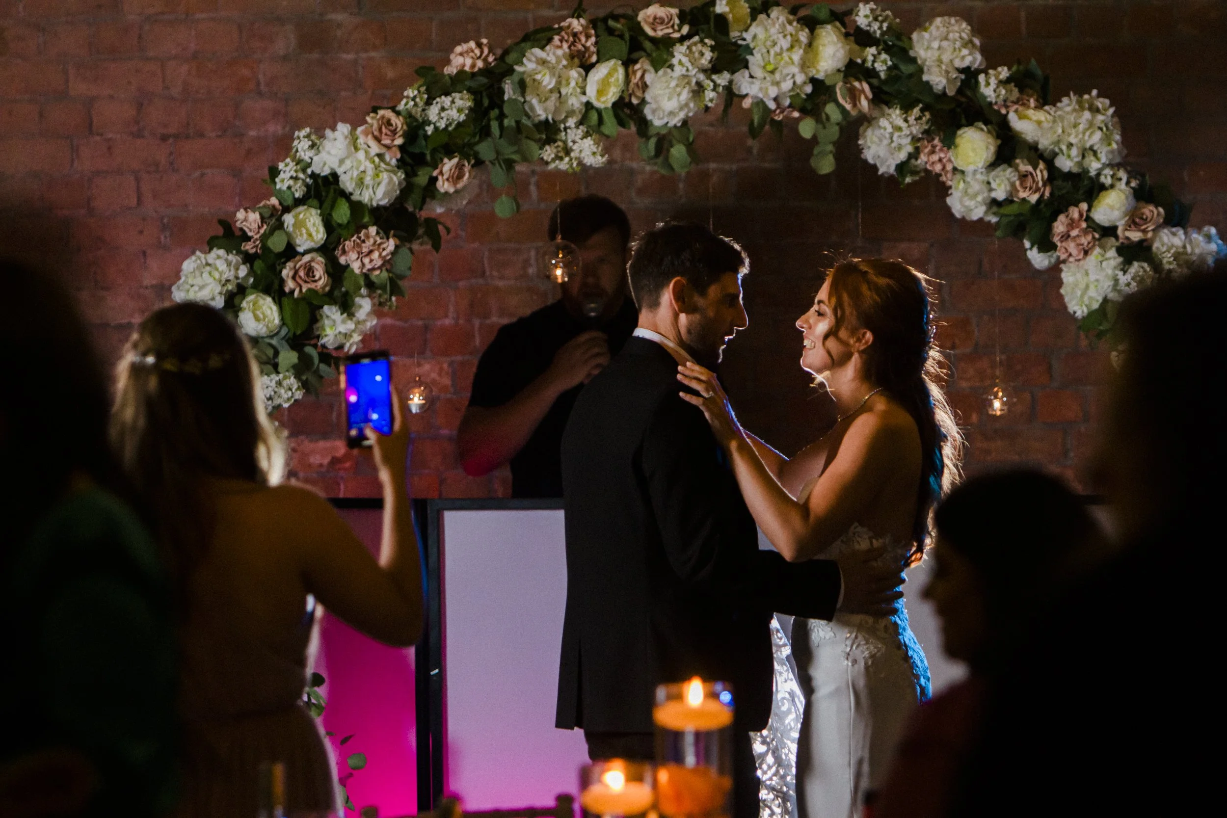 Elegant First Dance: Bride and Groom Gracefully Share Their First Dance at Titanic Hotel Liverpool, Marking the Start of a Beautiful Journey Together.