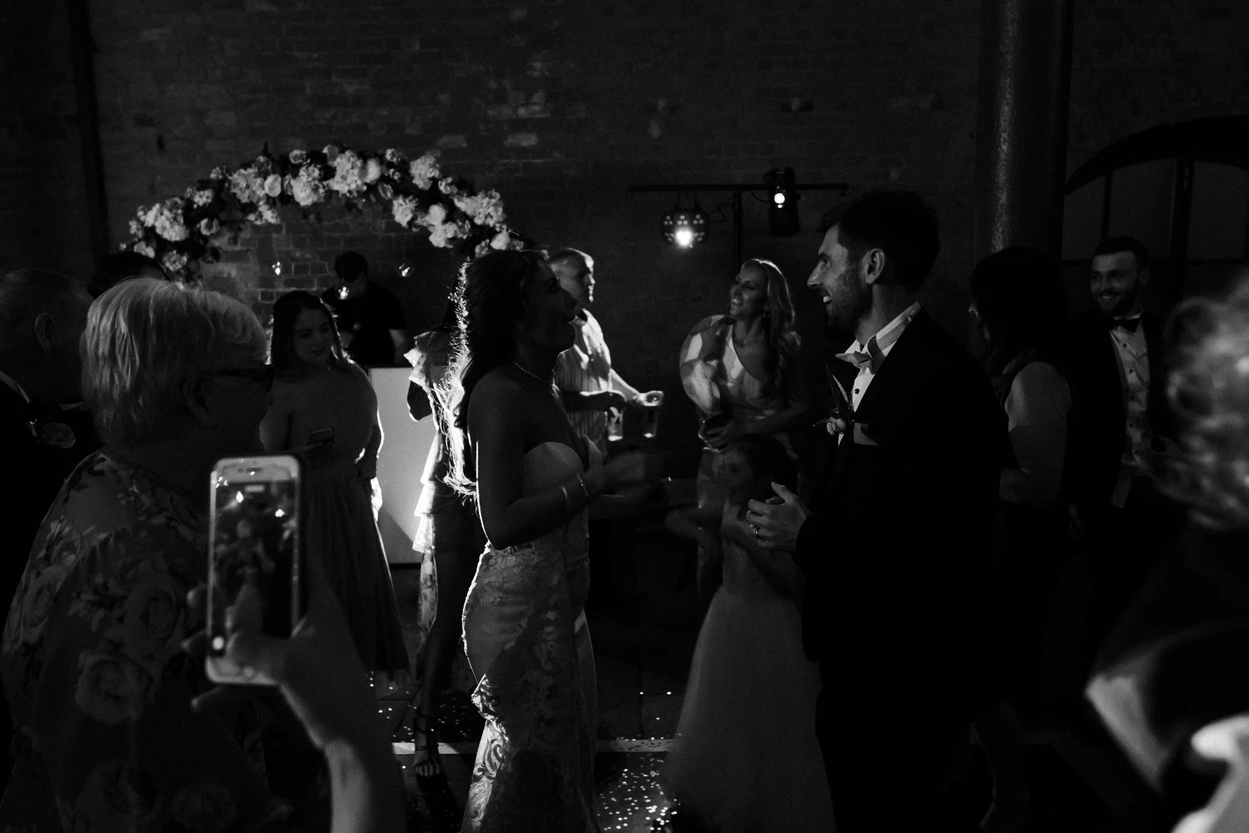 Dance Floor Delight: The Dance Floor Comes Alive with Joy and Sparkles of Confetti at Titanic Hotel Wedding in Liverpool, Creating a Vibrant and Memorable Atmosphere.
