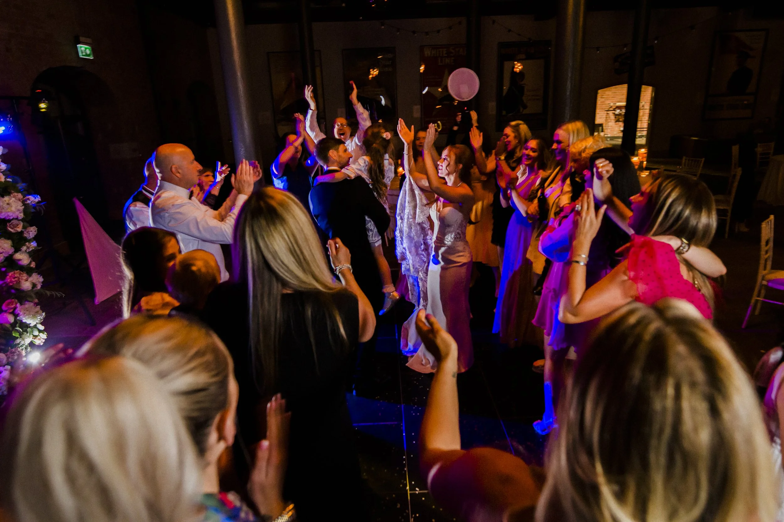 Lively Dance Floor: The Dance Floor at Titanic Hotel Liverpool Wedding Is Packed with Energetic Guests, All Partying and Celebrating in High Spirits.