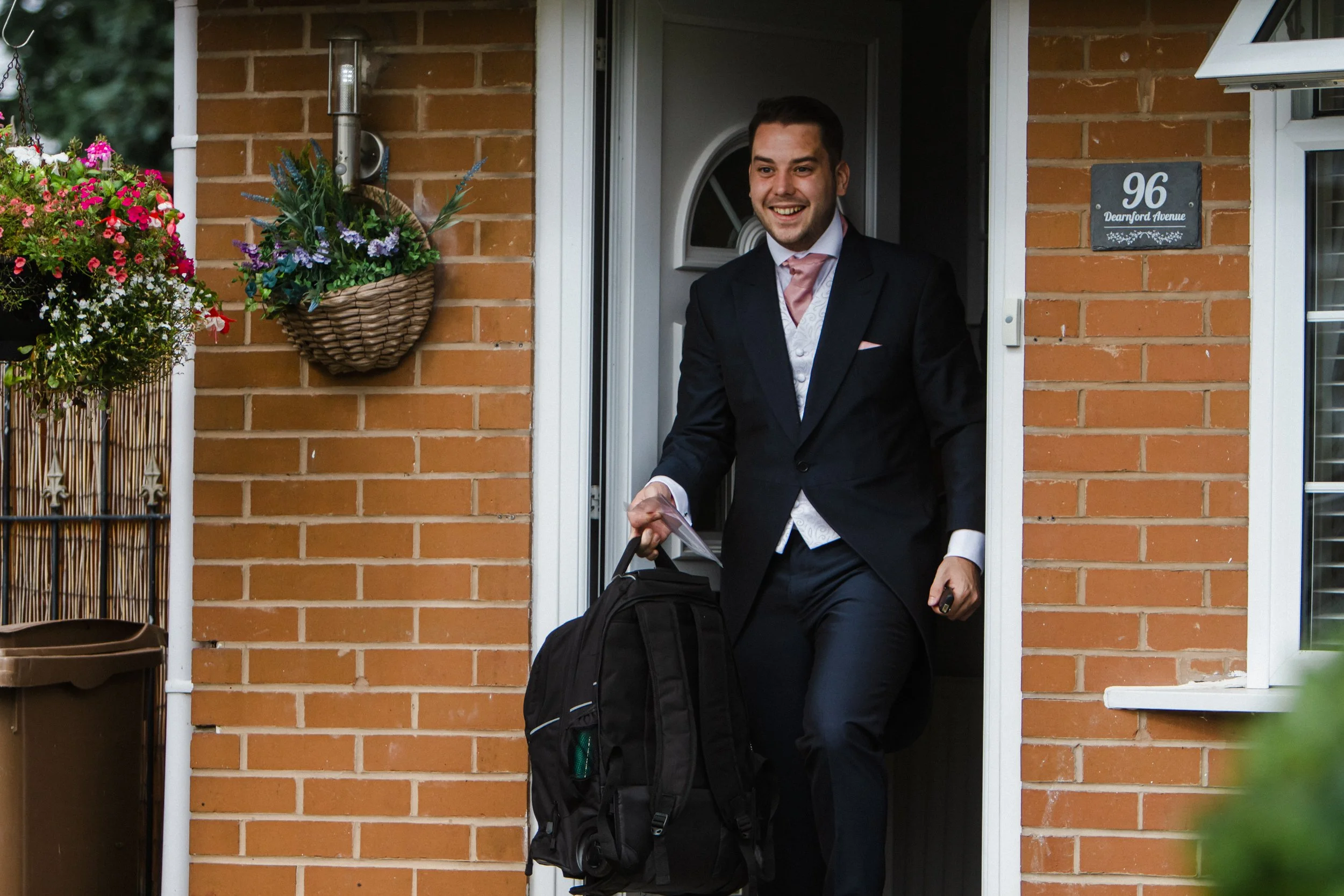 Joyful Surprise: The Groom Expresses His Happiness and Surprise as He Sees the Wedding Camper Van, Brook Hall Wedding Photography.