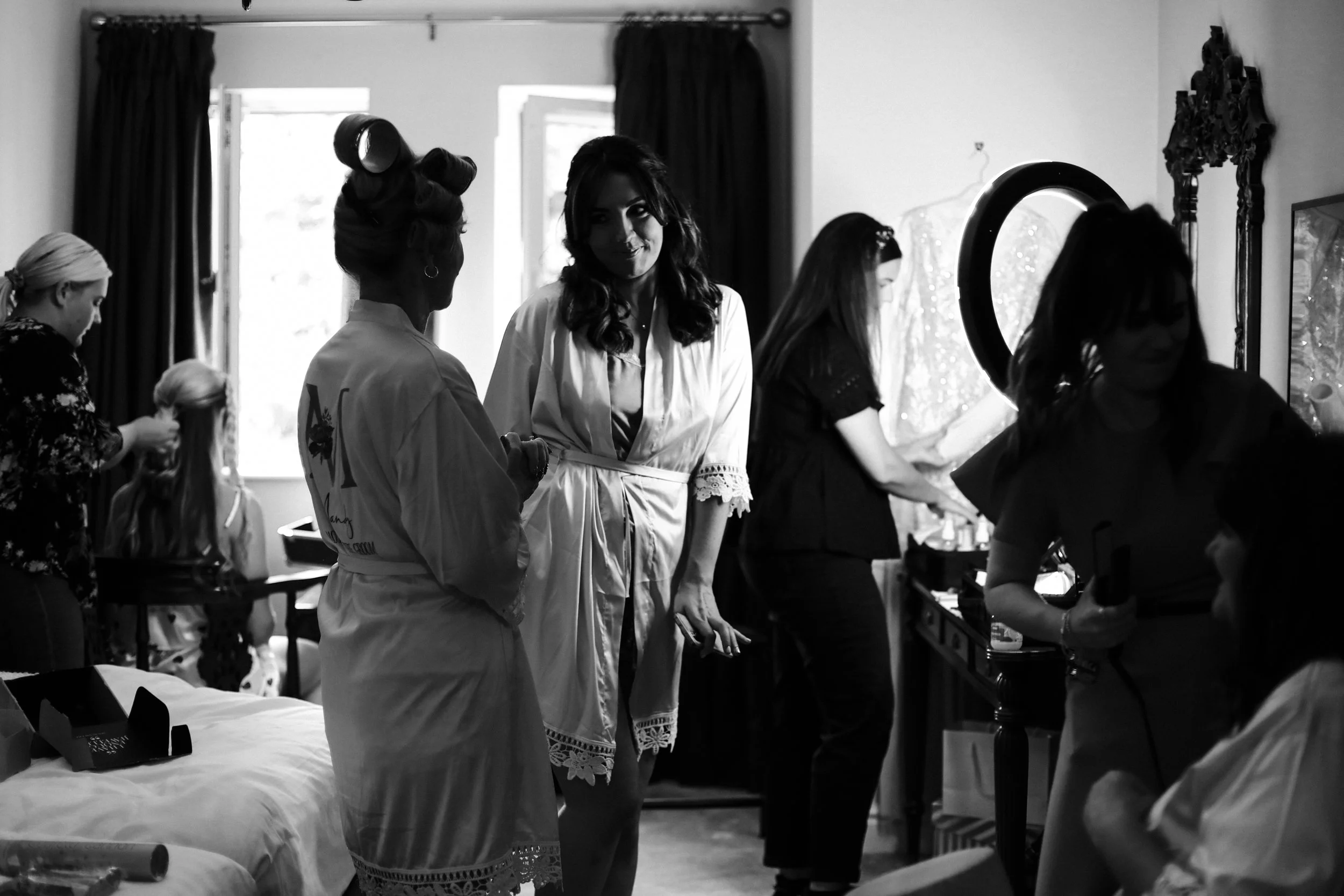 Bridesmaid's Delight: A Bridesmaid Radiates Joy and Satisfaction with Her Hair and Makeup, Captured during the Morning Preparations at Brook Hall Wedding.