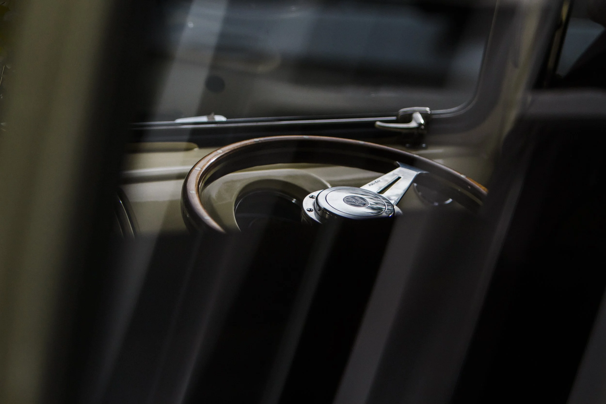 Steering into Forever: A Close-Up Shot of the Camper Van's Steering Wheel, at Brook Hall Wedding, Adding a Nostalgic Touch to the Wedding Story