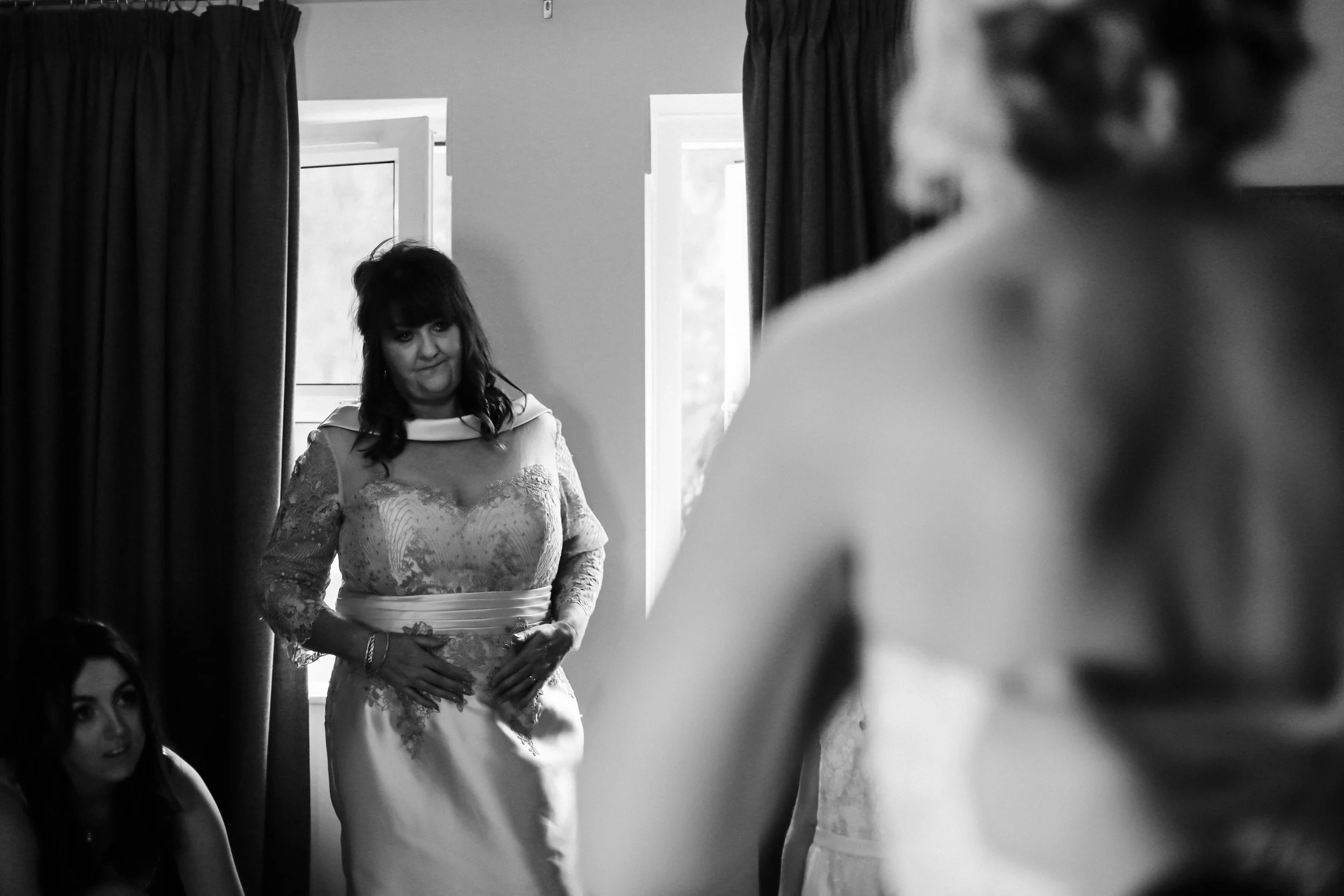 mother of the bride emotionally looking at daughter brook hall hotel  