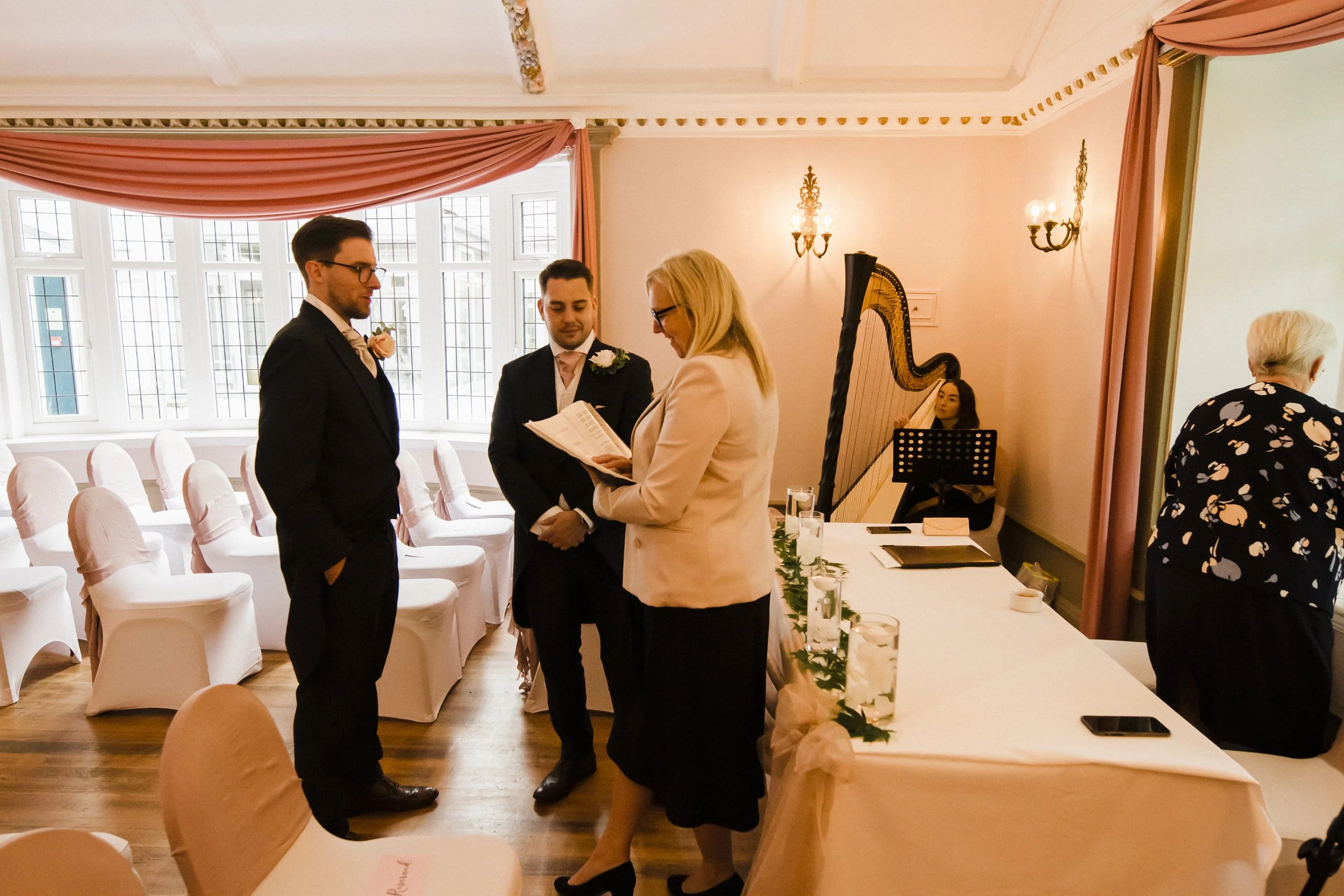 Groom with groomsmen and registrar Brook Hall wedding photographer  