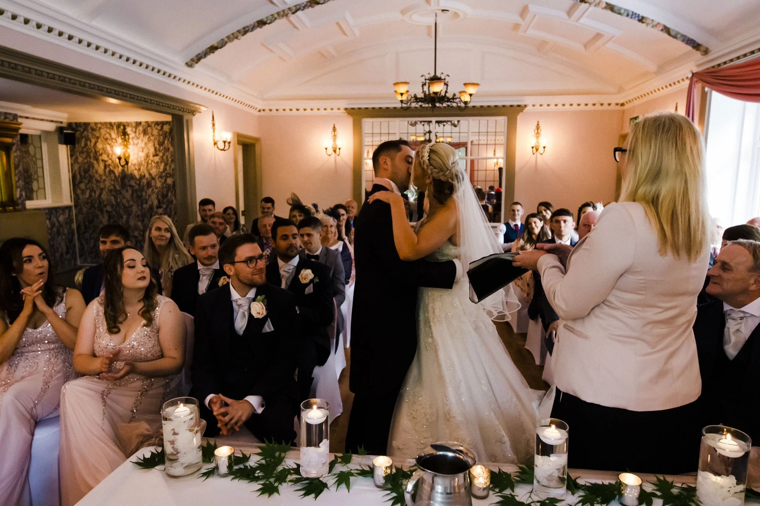 bride and grooms kiss Brook Hall hotel wedding photography