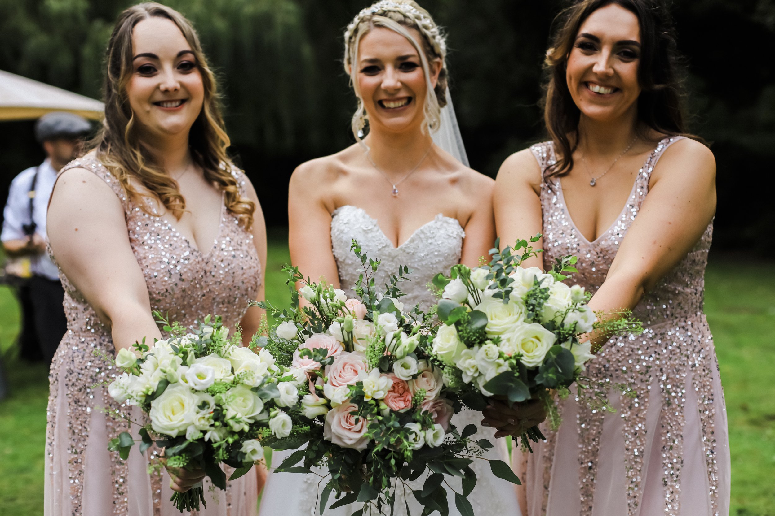 bride and bridesmaids with bouquets Brook Hall hotel wedding photography