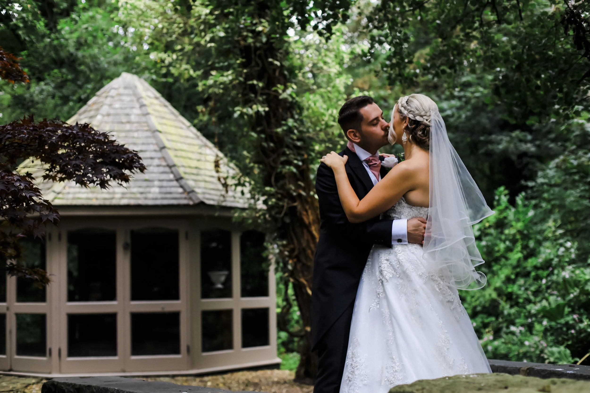 Sealed with a Kiss: Bride and Groom Share a Romantic Kiss in This Brook Hall Hotel Wedding