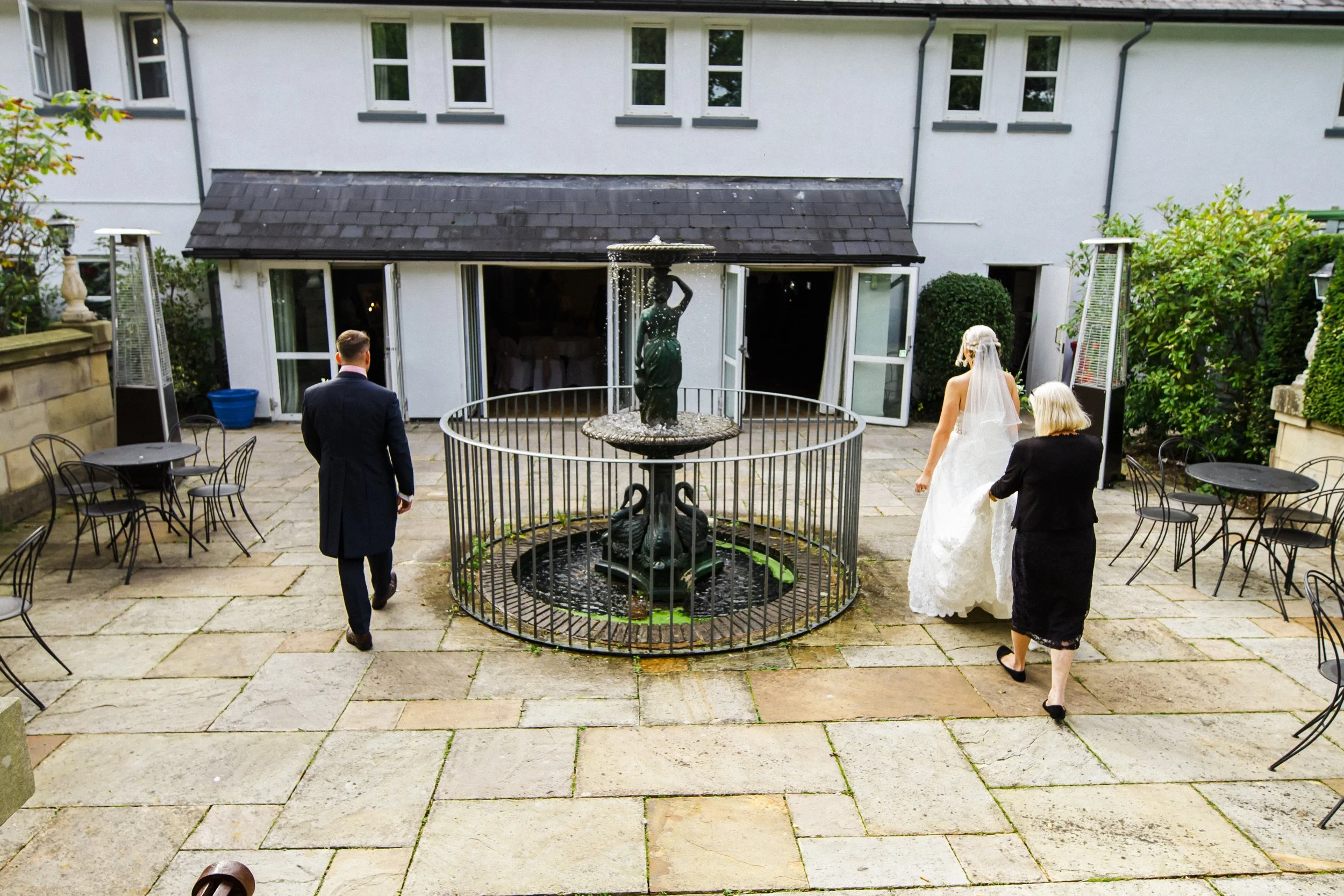 bride and groom entering for their wedding breakfast 