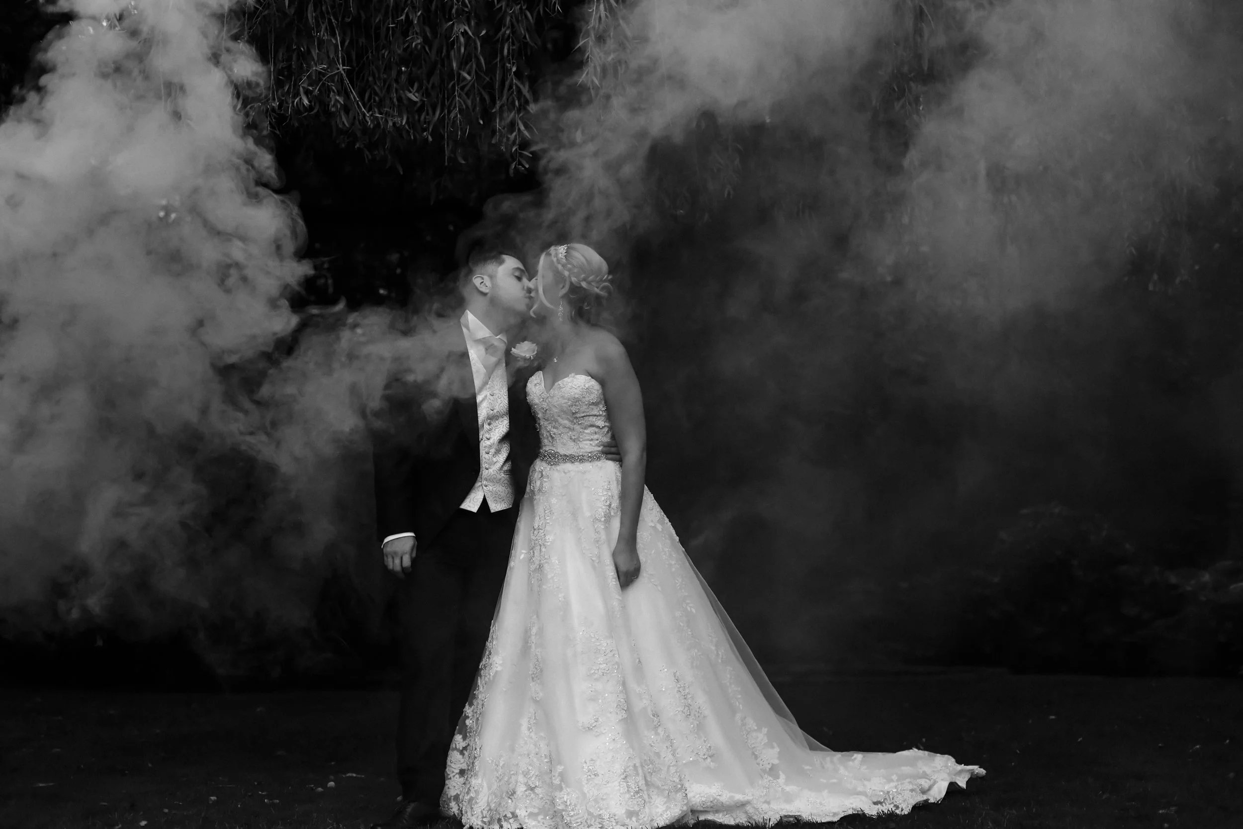 bride and groom black and white with smoke Brook Hall hotel wedding photography