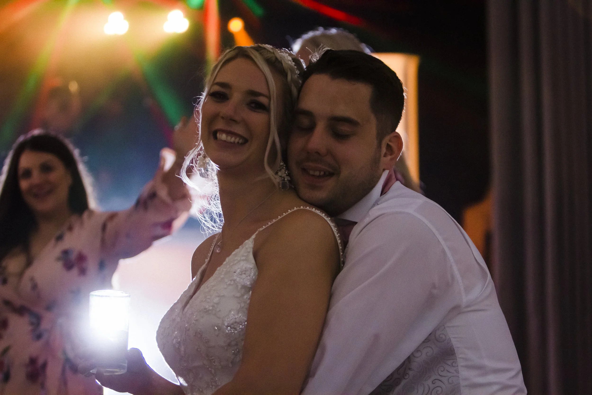 End of a Magical Day: Groom Holds His Beloved Bride on the Dance Floor in This Brook Hall Hotel Wedding Photography Moment