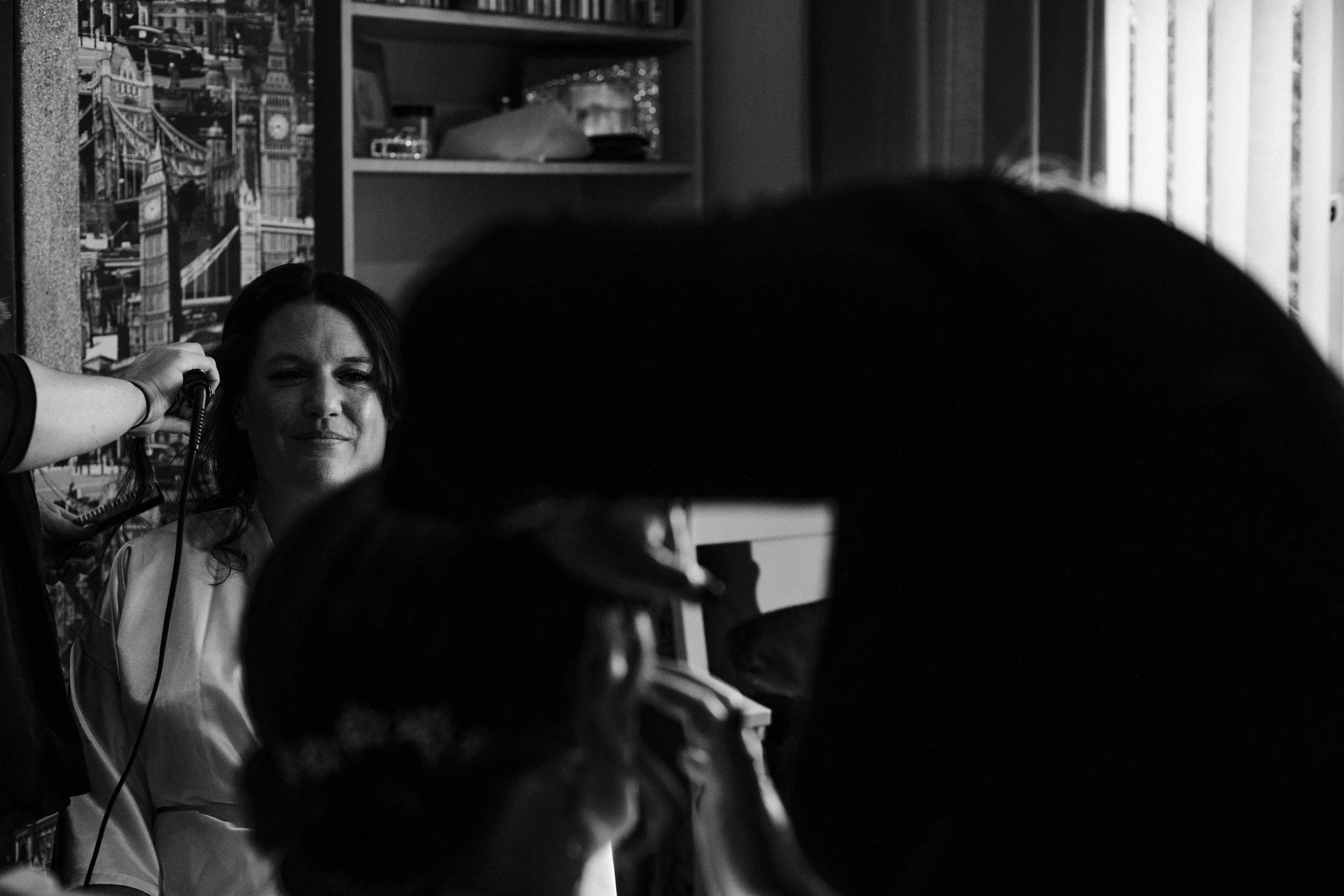 Winter Bridal Prep: Candid Moments as the Bride and Her Bridesmaids Get Hair and Makeup Done on a Beautiful Wirral Winter Wedding Morning 