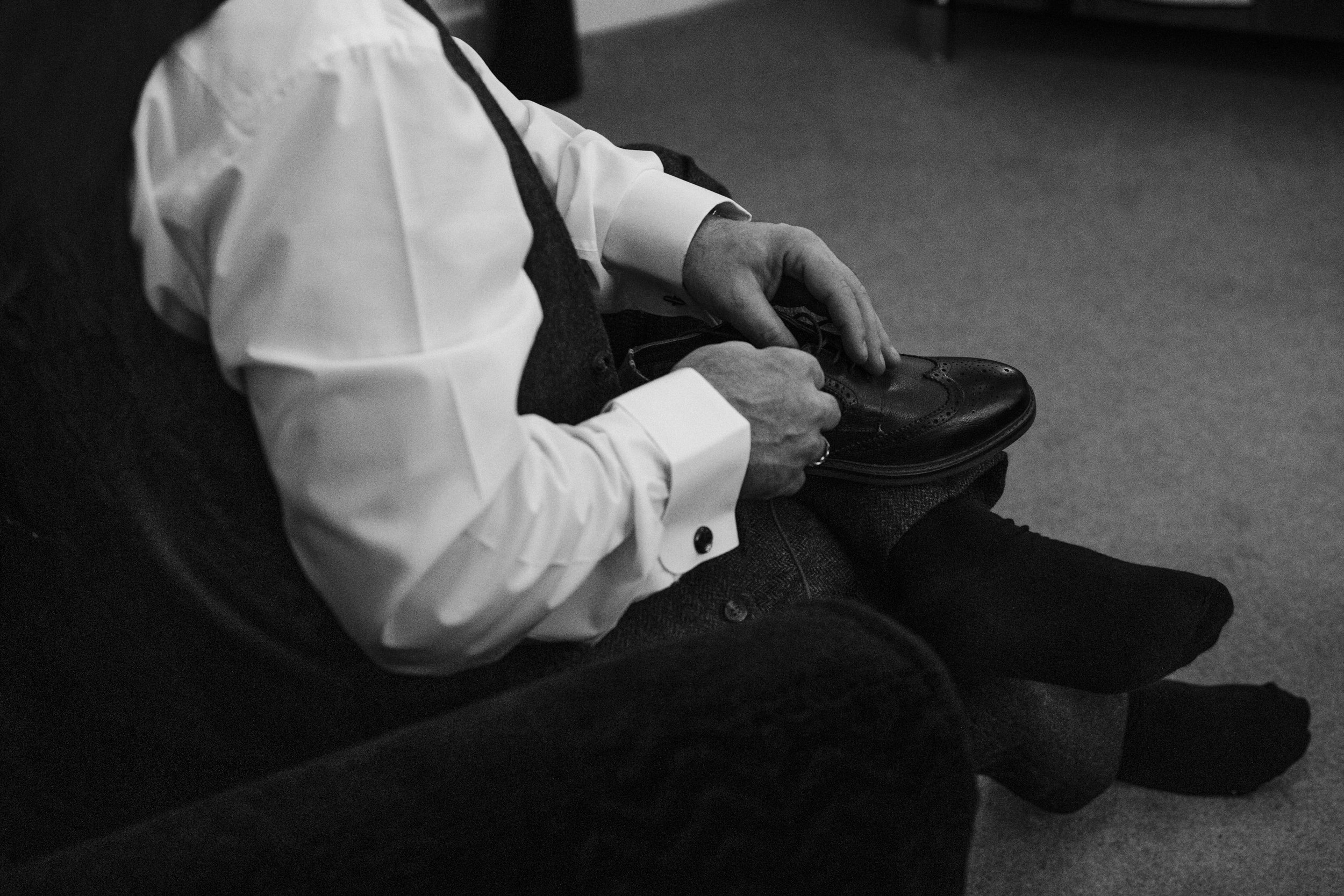 Winter Groom Prep: Candid Moments as the Groom and His Groomsmen Suit Up on a Beautiful Wirral Winter Wedding Morning