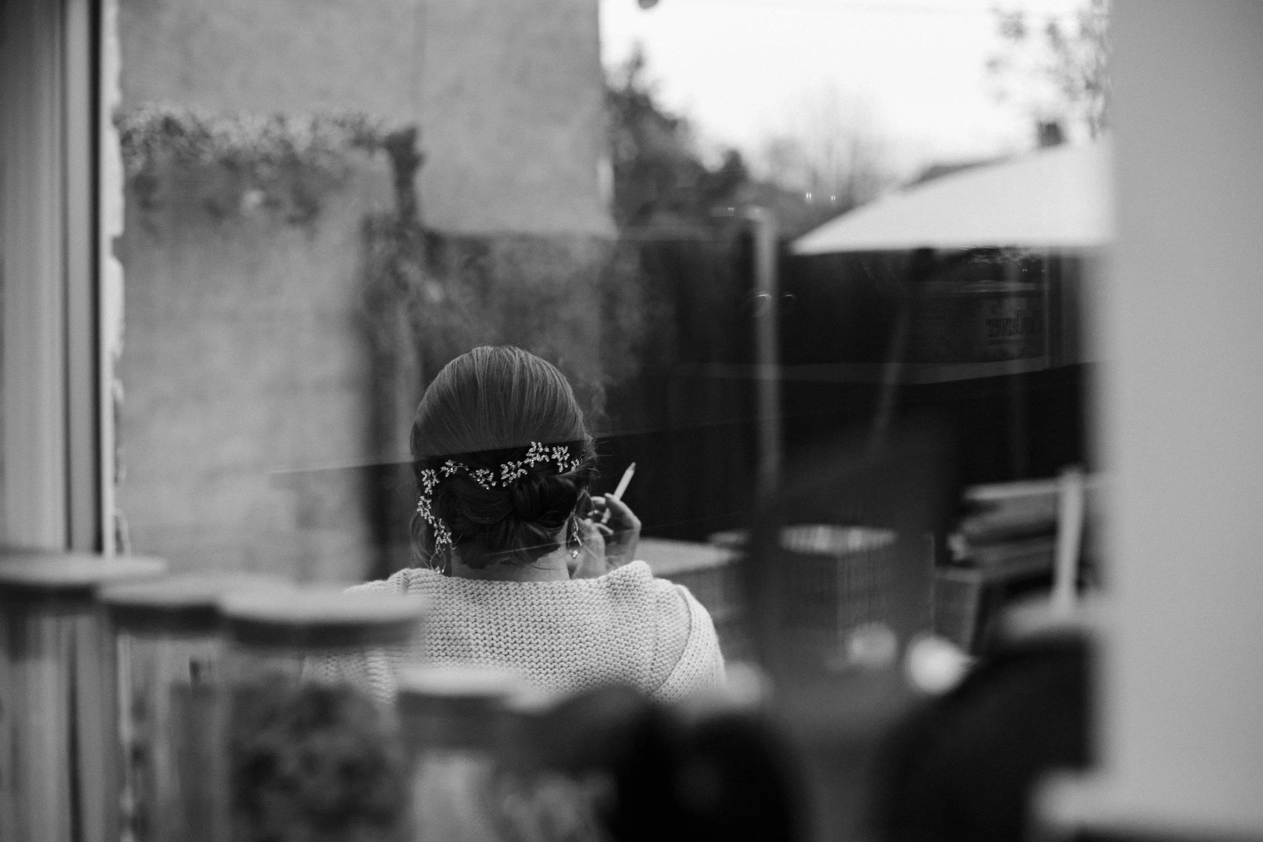 Winter Bridal Prep: the bride steals a candid moment, reflecting capturing the essence of a charming Wirral winter wedding