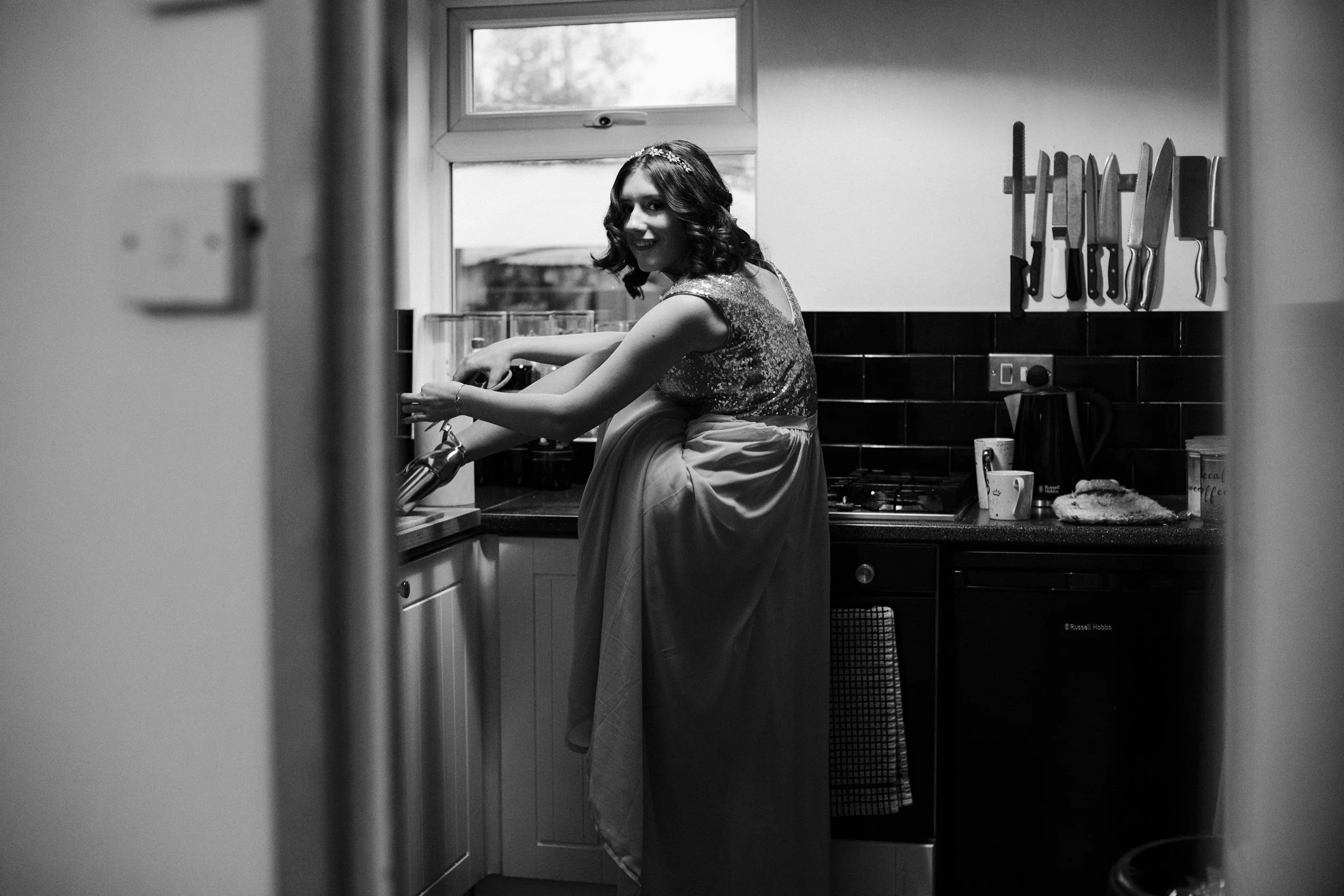 Bridesmaid's Playful Mishap: Wrestling with Shoe Labels Before the Wirral Winter Wedding
