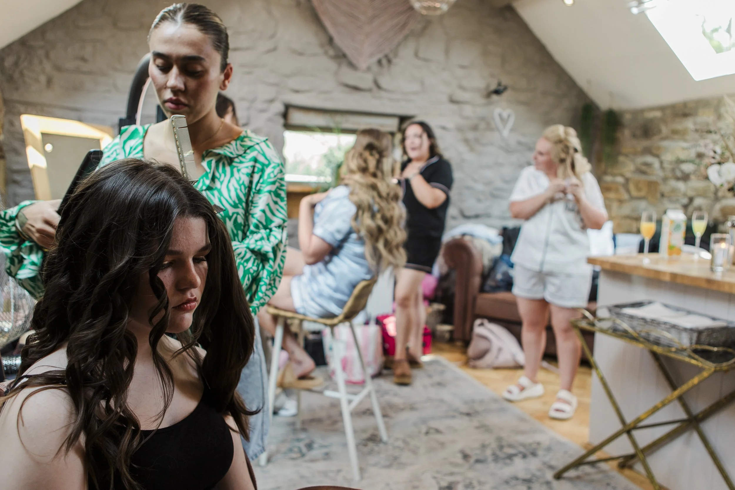 Rustic Beauty: Wide Shot of Bride and Bridesmaids Getting Hair Done at Tower Hill Barns