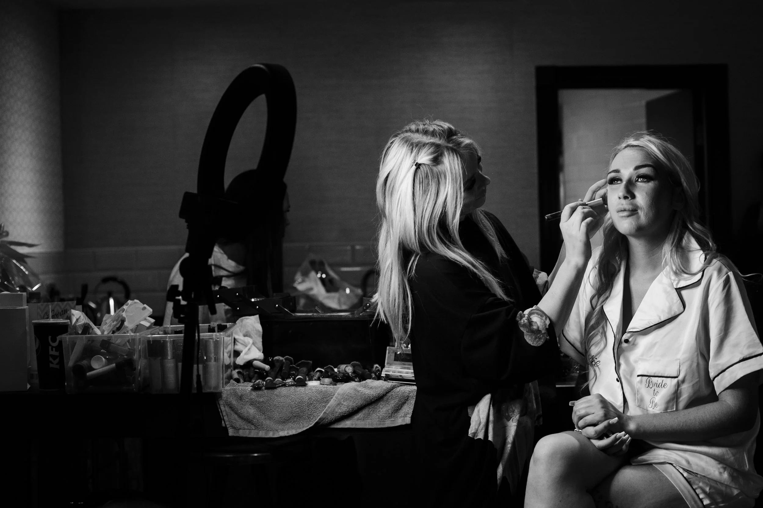 Blissful Bride prep: The Bride enjoys a moment of Serenity as her makeup is expertly applied at Shankly Hotel wedding Merseyside 