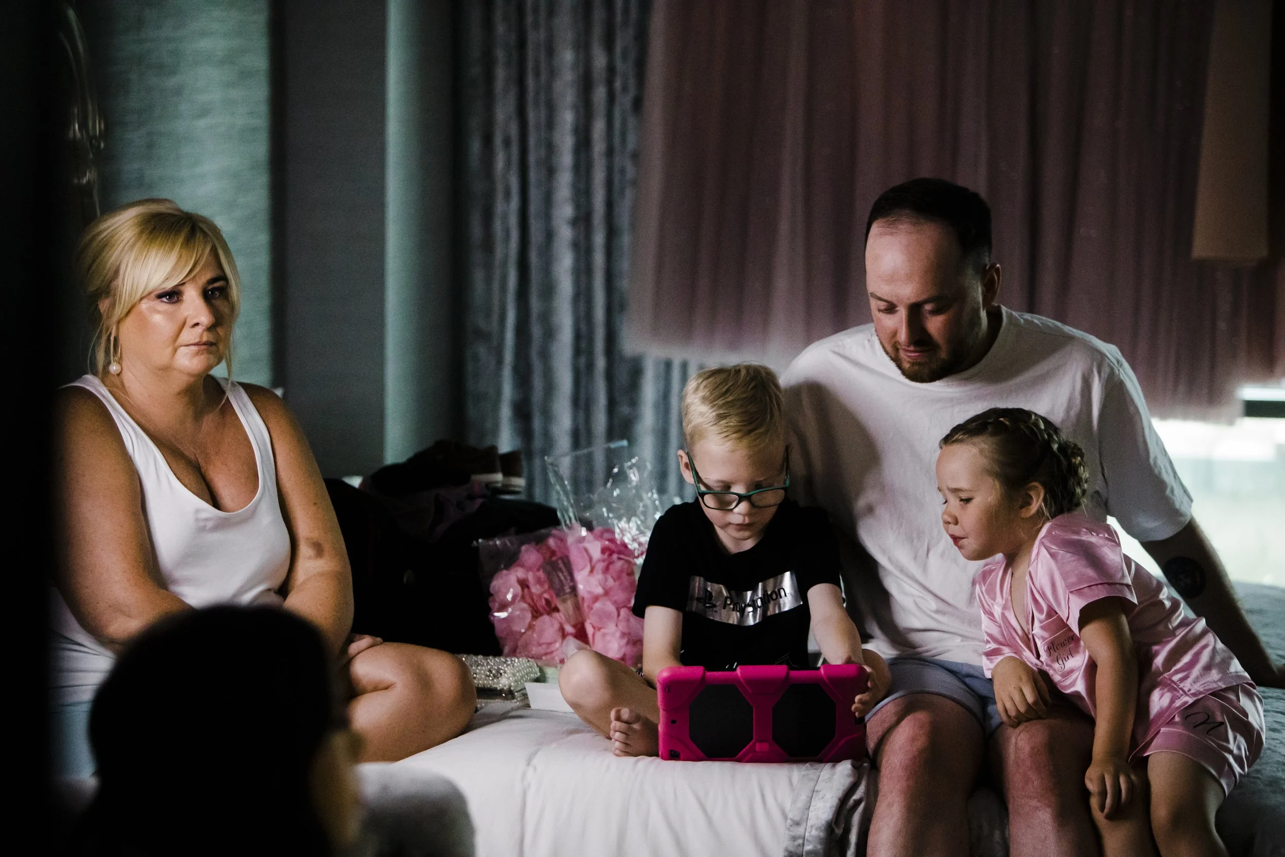 Playful Pace: Candid Moment Captured as the Bride gets makeup applied kids play with iPad Shankly Hotel wedding Merseyside