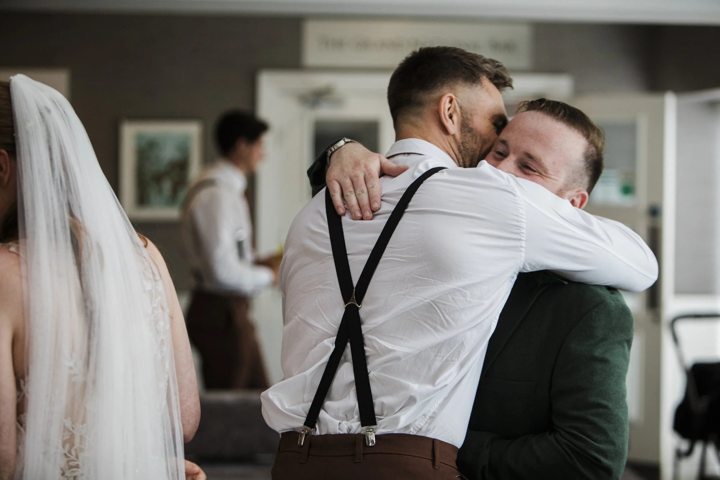 The Park Hotel Liverpool Wedding Photography: Post-Ceremony Brotherhood Embrace
