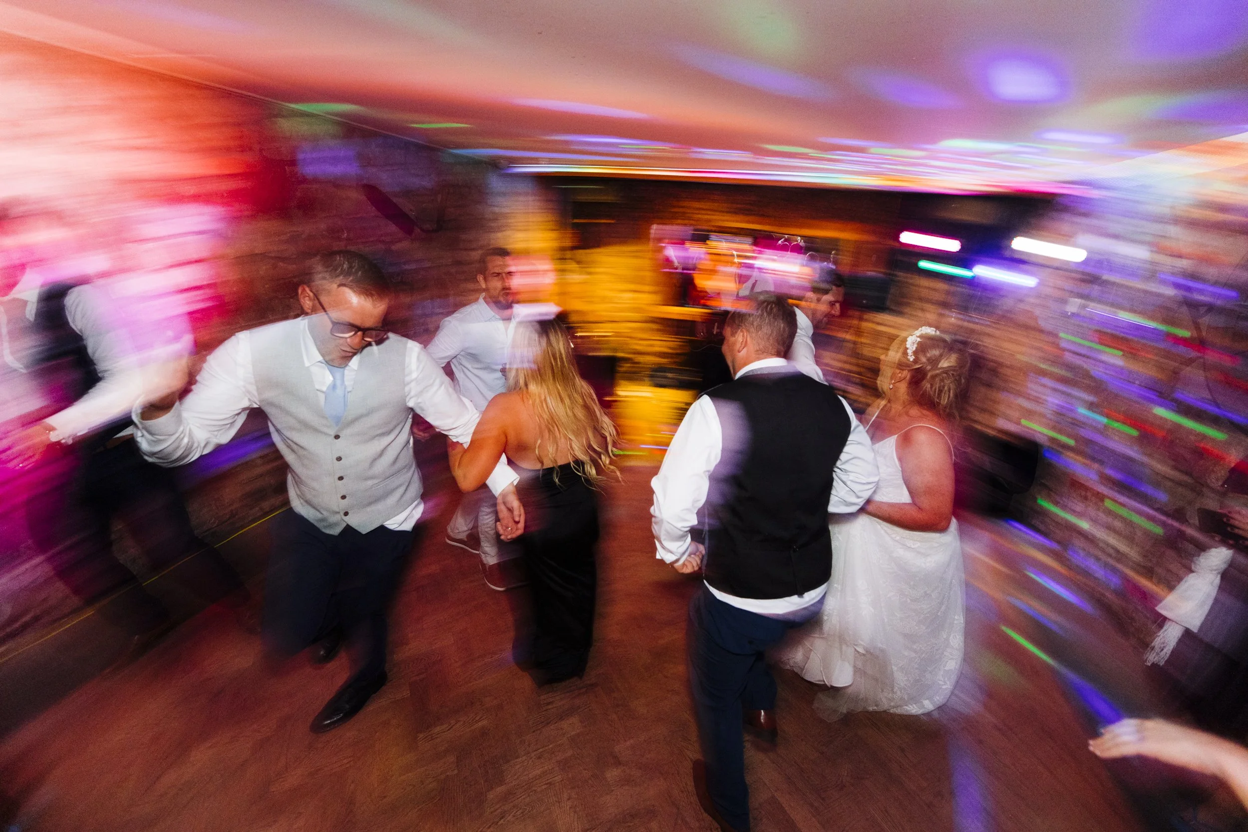 Vibrant energy on the dance floor at Tower Hill Barns wedding full day photography