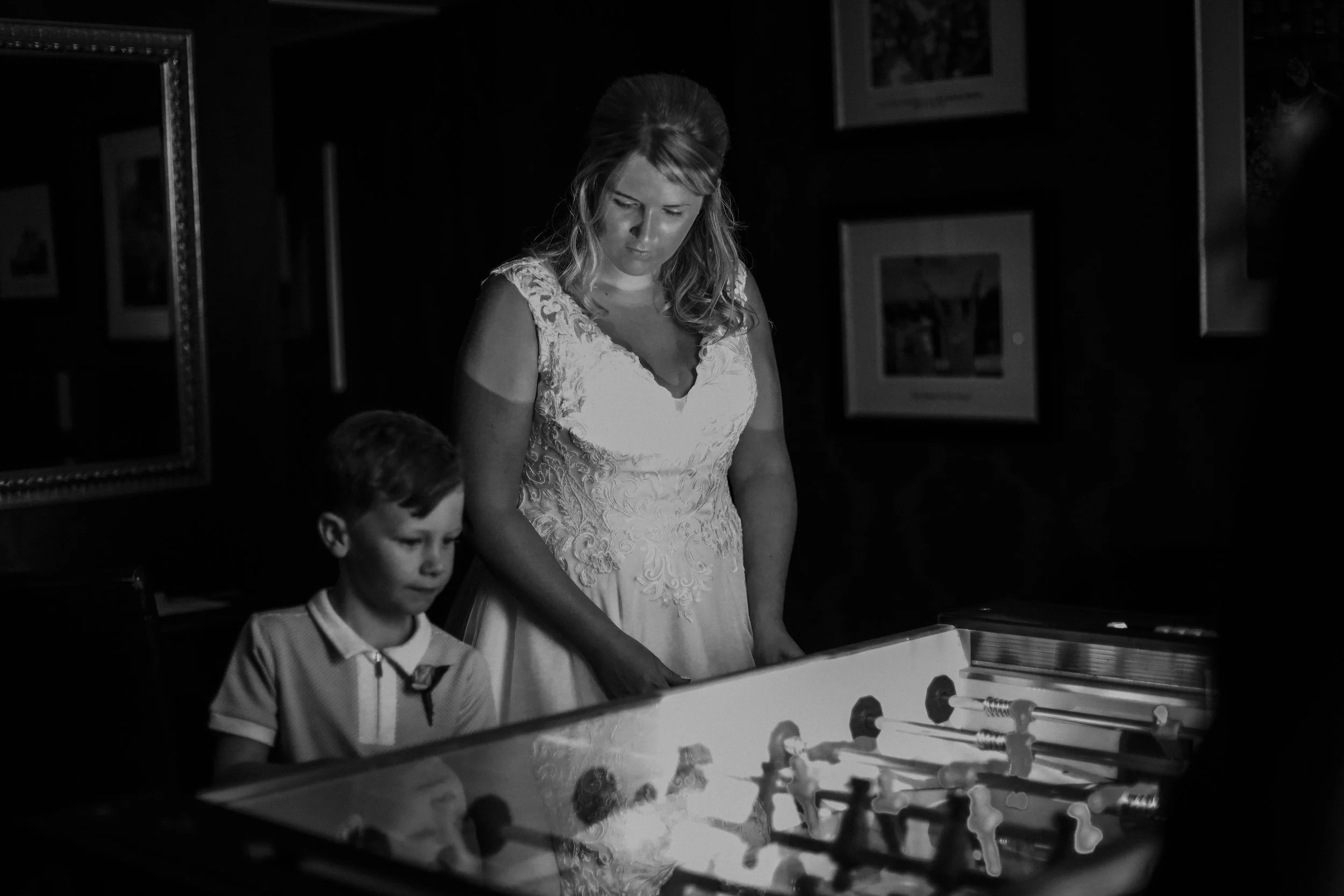 bride playing foosball with young son at the Malmaison hotel Liverpool 