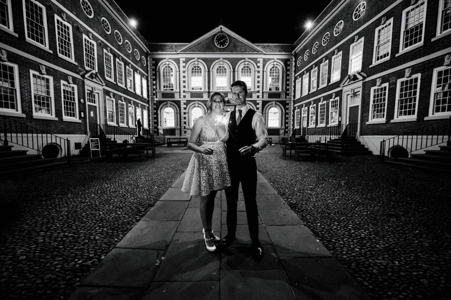 In this stunning black and white image, a bride and groom stands in the Bluecoat courtyard, Liverpool's oldest city-centre building and contemporary arts hub.