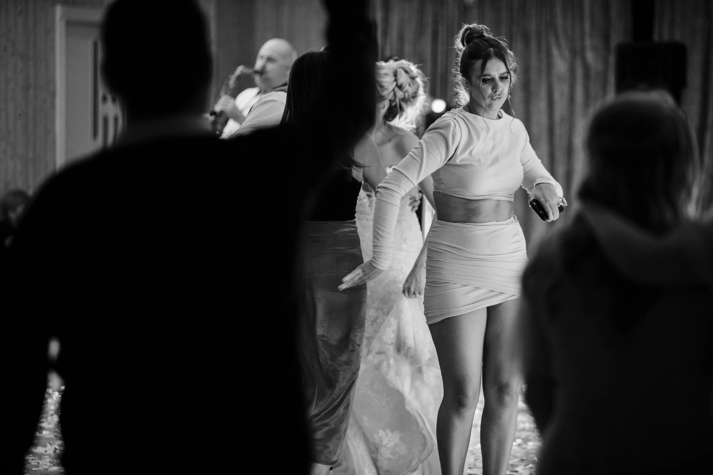 Monochrome charm unfolds at Shankly Liverpool Hotel as guests dance, capturing a timeless elegance that adds a classic touch to the lively atmosphere of the event