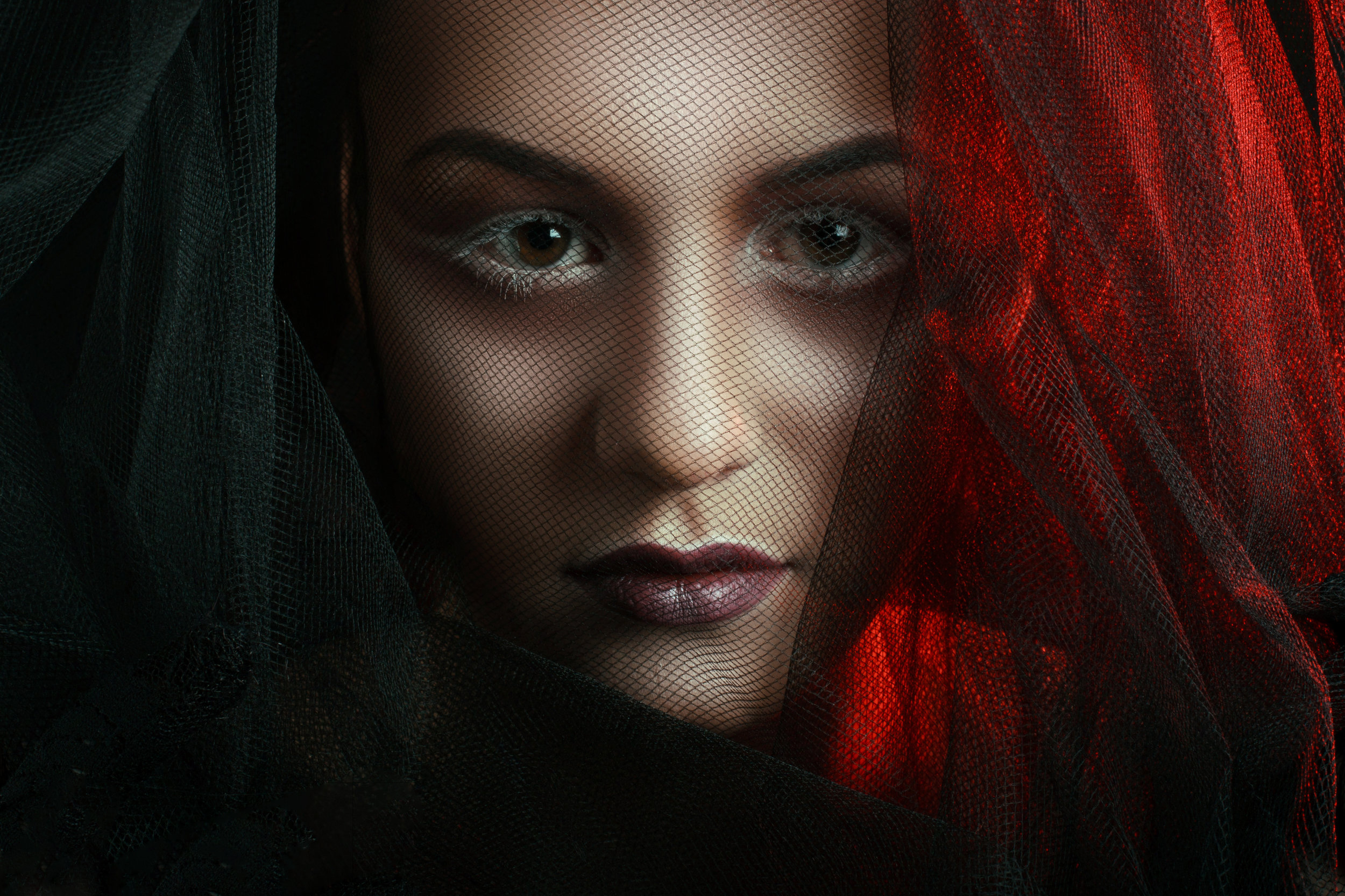 Mysterious Woman Portrait. Beautiful Model Woman Face Closeup