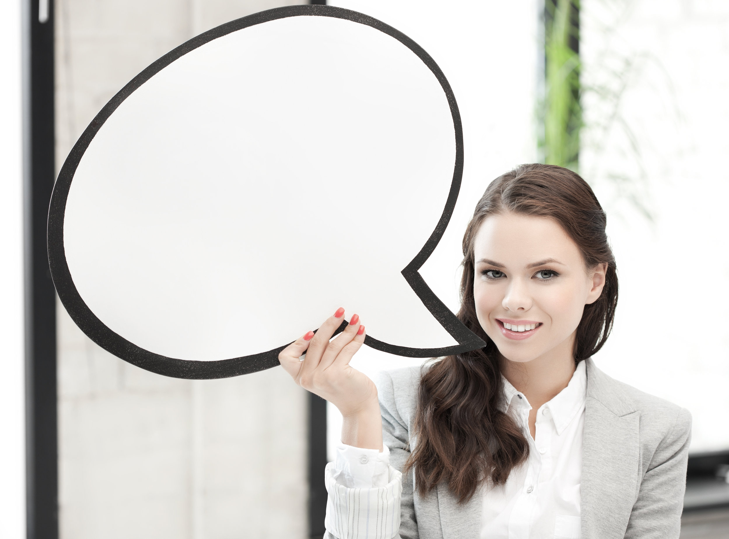 smiling businesswoman with blank text bubble