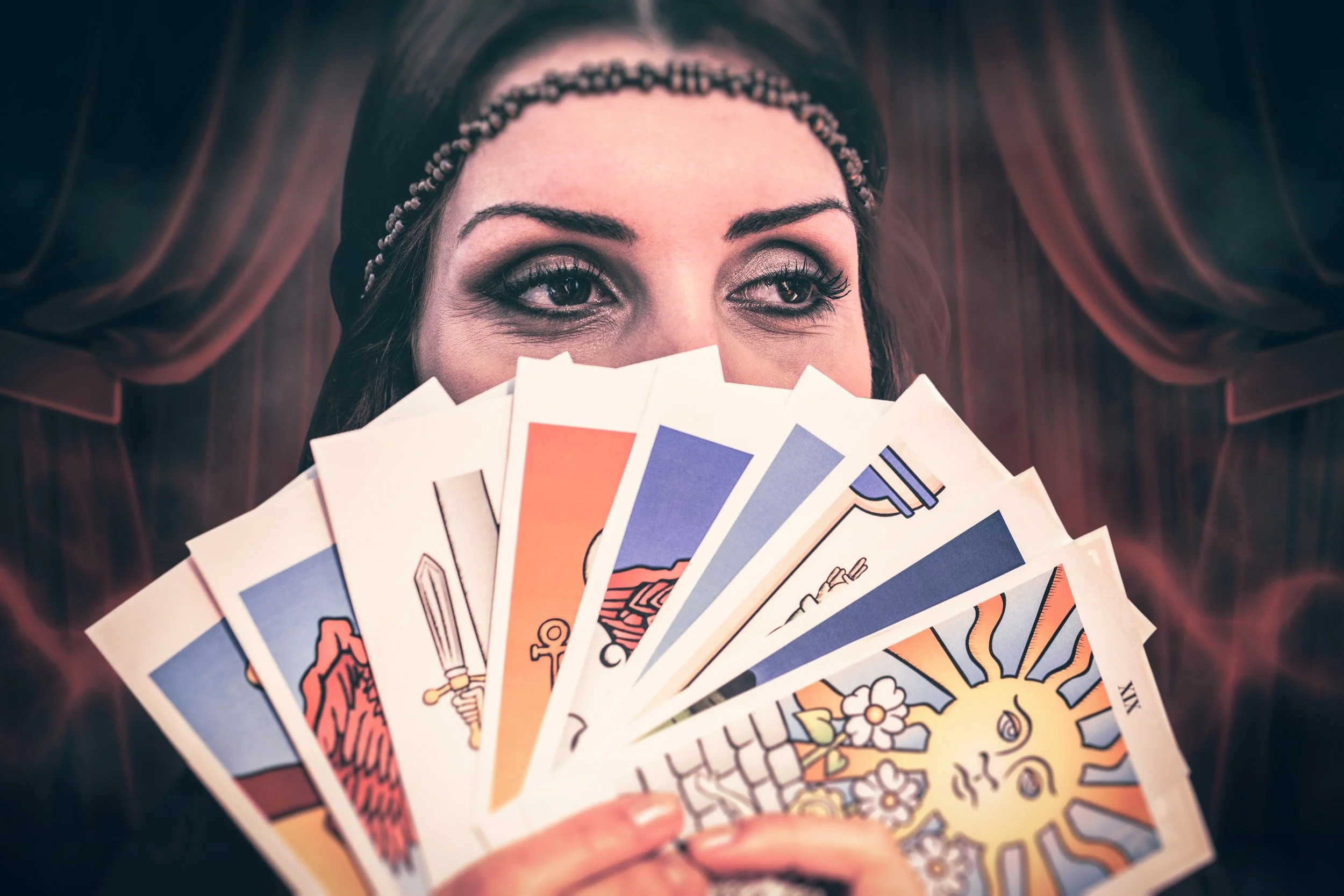 Fortune teller holding tarot cards