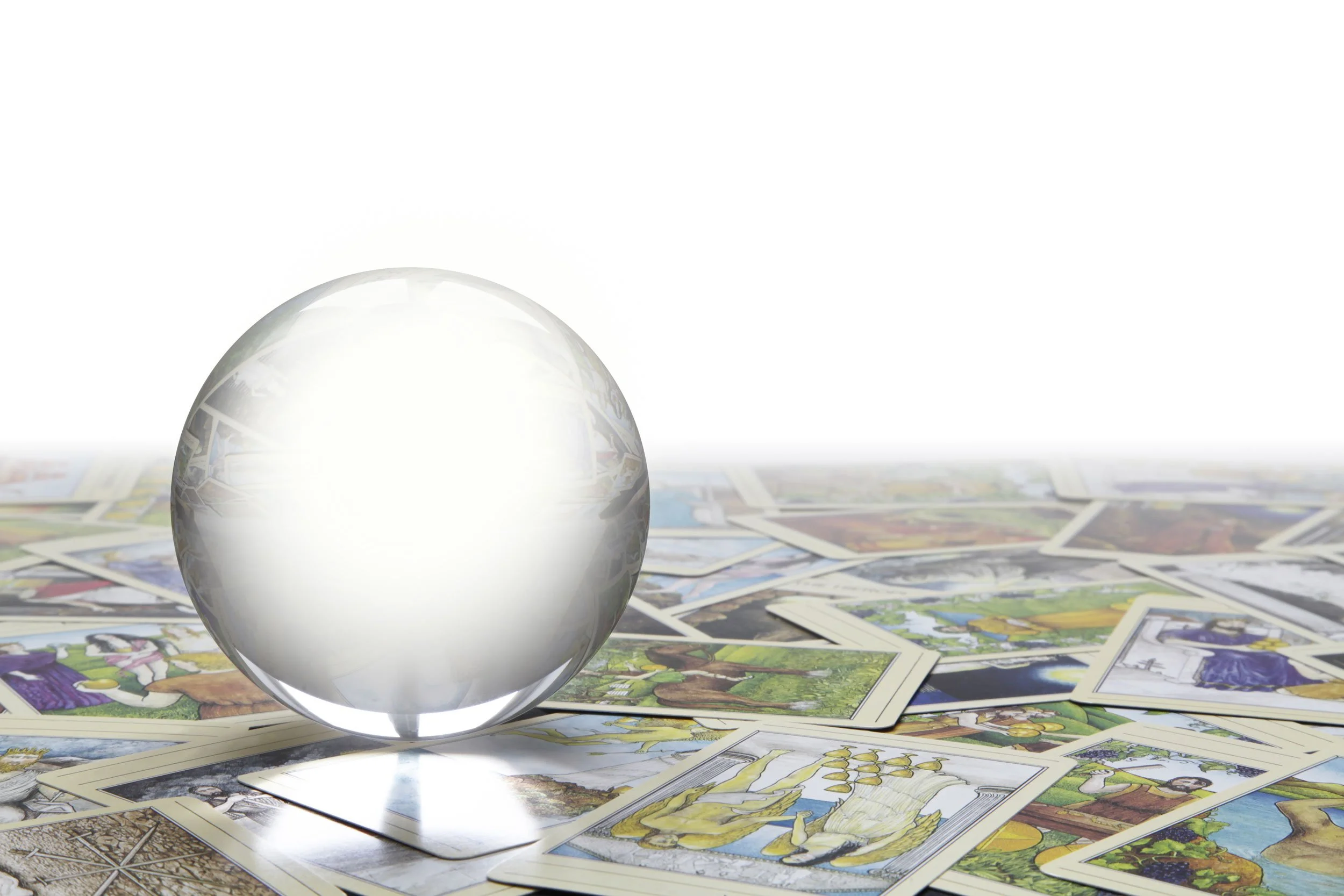 A crystal ball on tarot cards