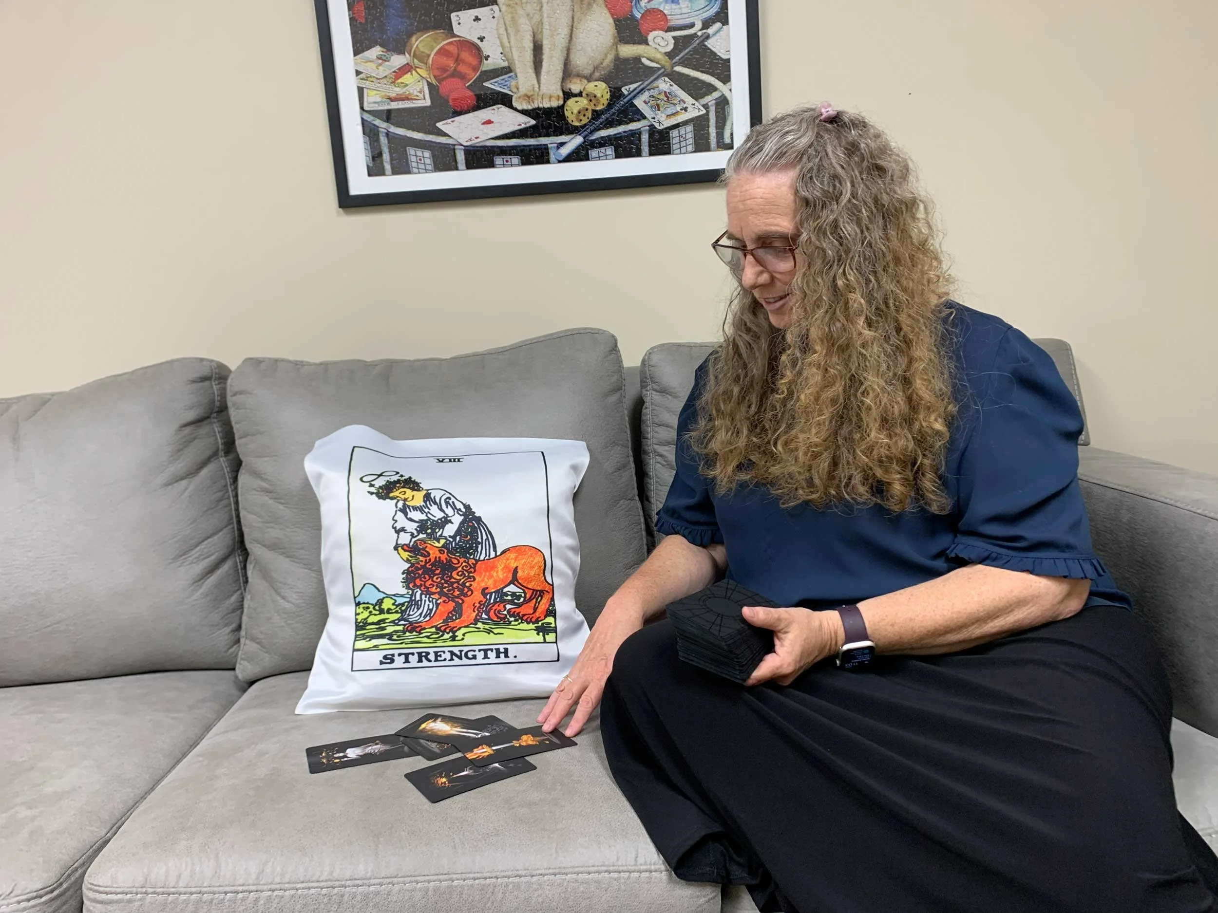 Christiana reading cards for herself, circa 2022