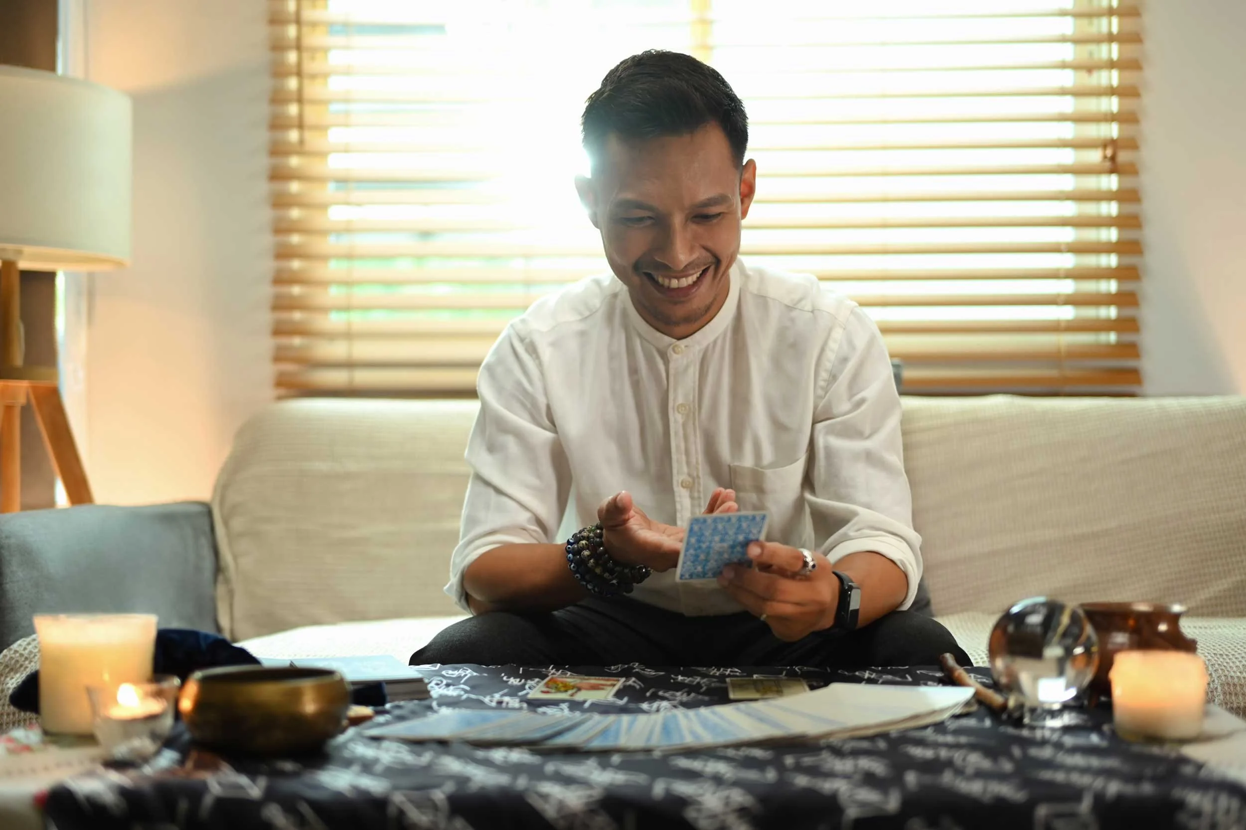 An tarot reader finds good news in a card.