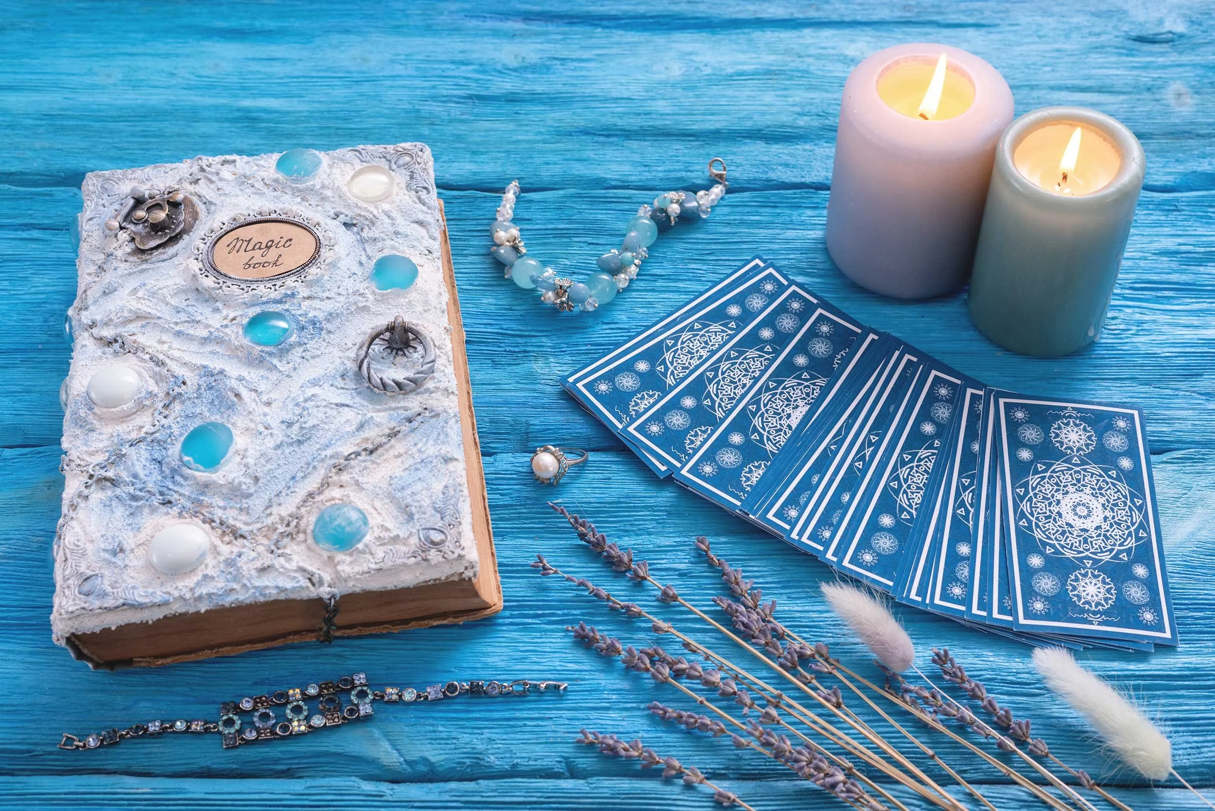 Tarot Cards, candles, and a journal.