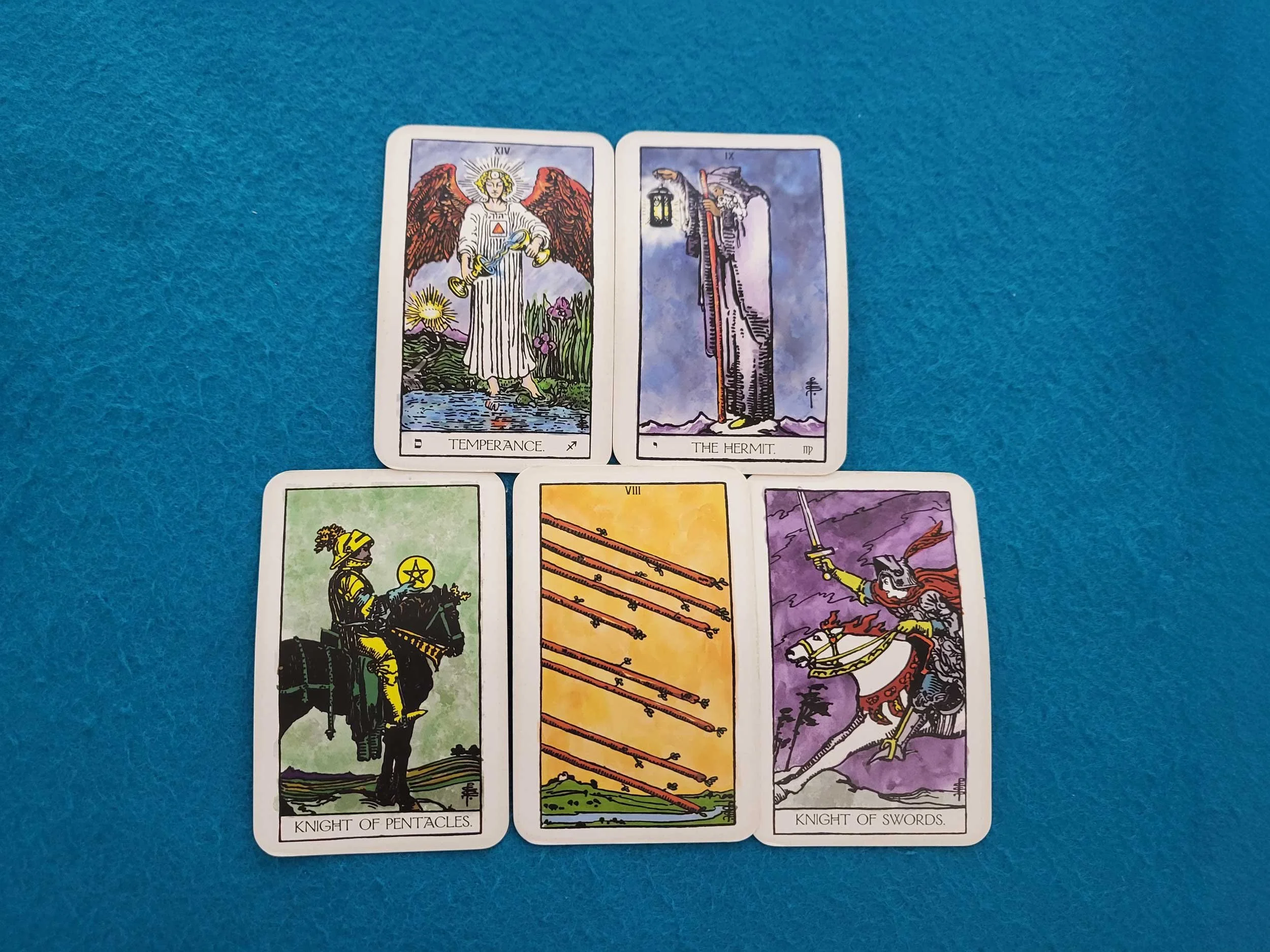 Tarot Cards: Temperance, the Hermit, the Knight of Pentacles, the Eight of Wands and the Knight of Swords.