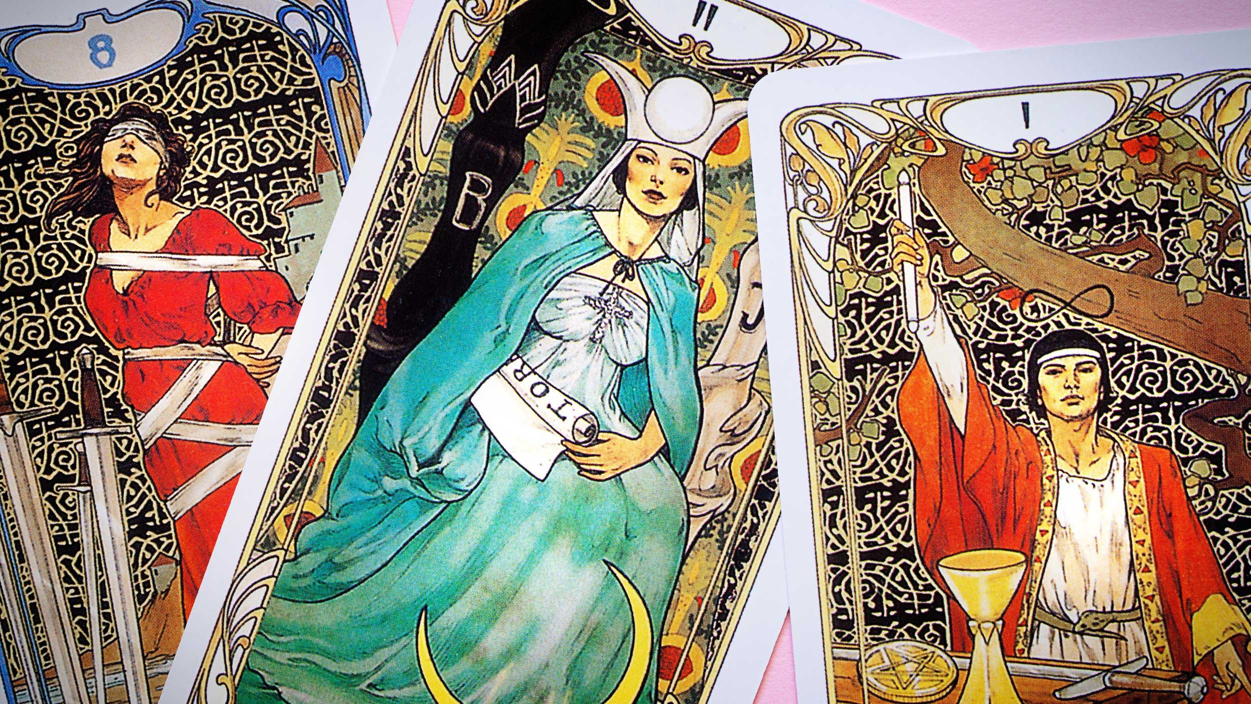 Tarot Cards, featuring the High Priestess, the Magician, and the Eight of Swords