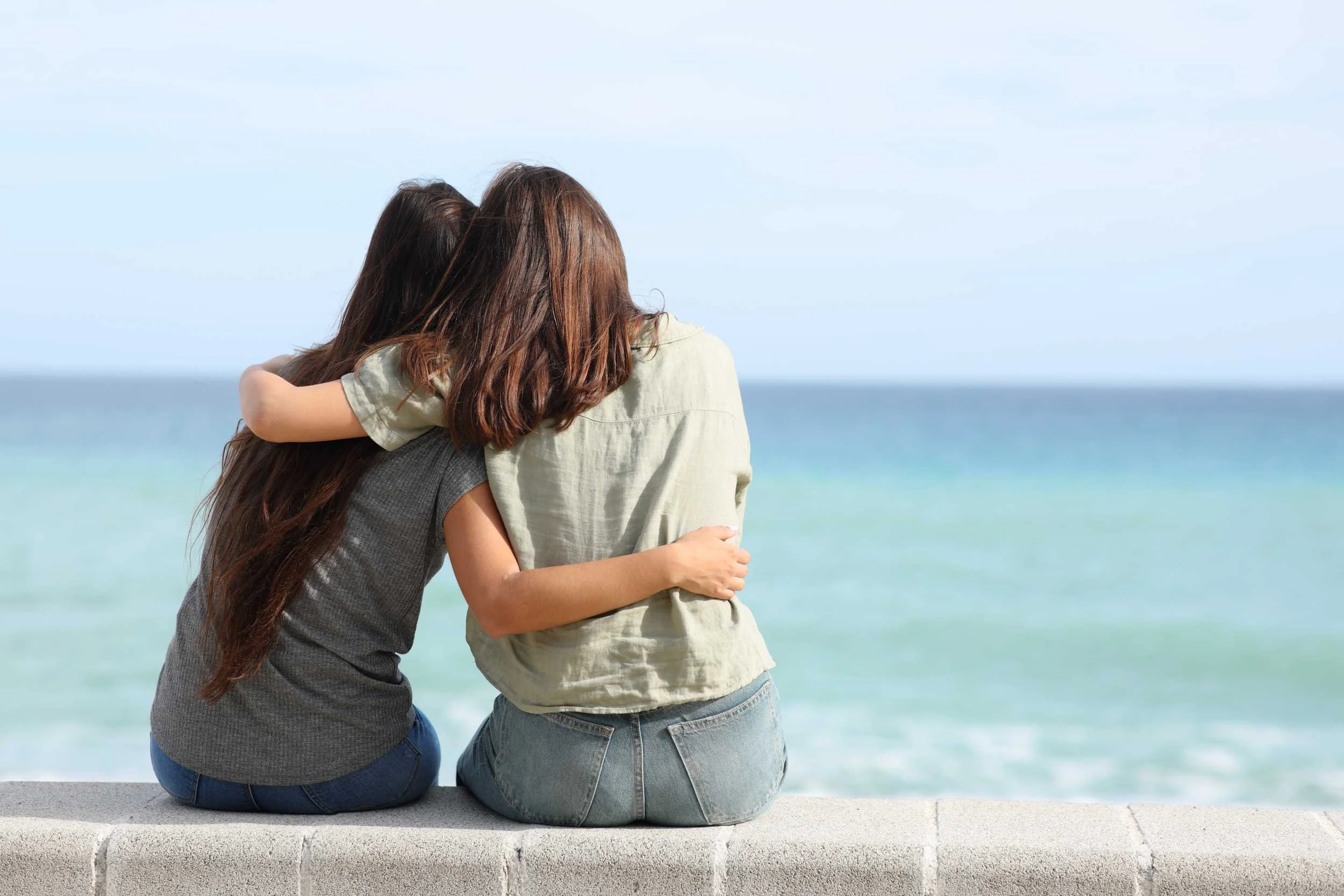 Two friends at the ocean.