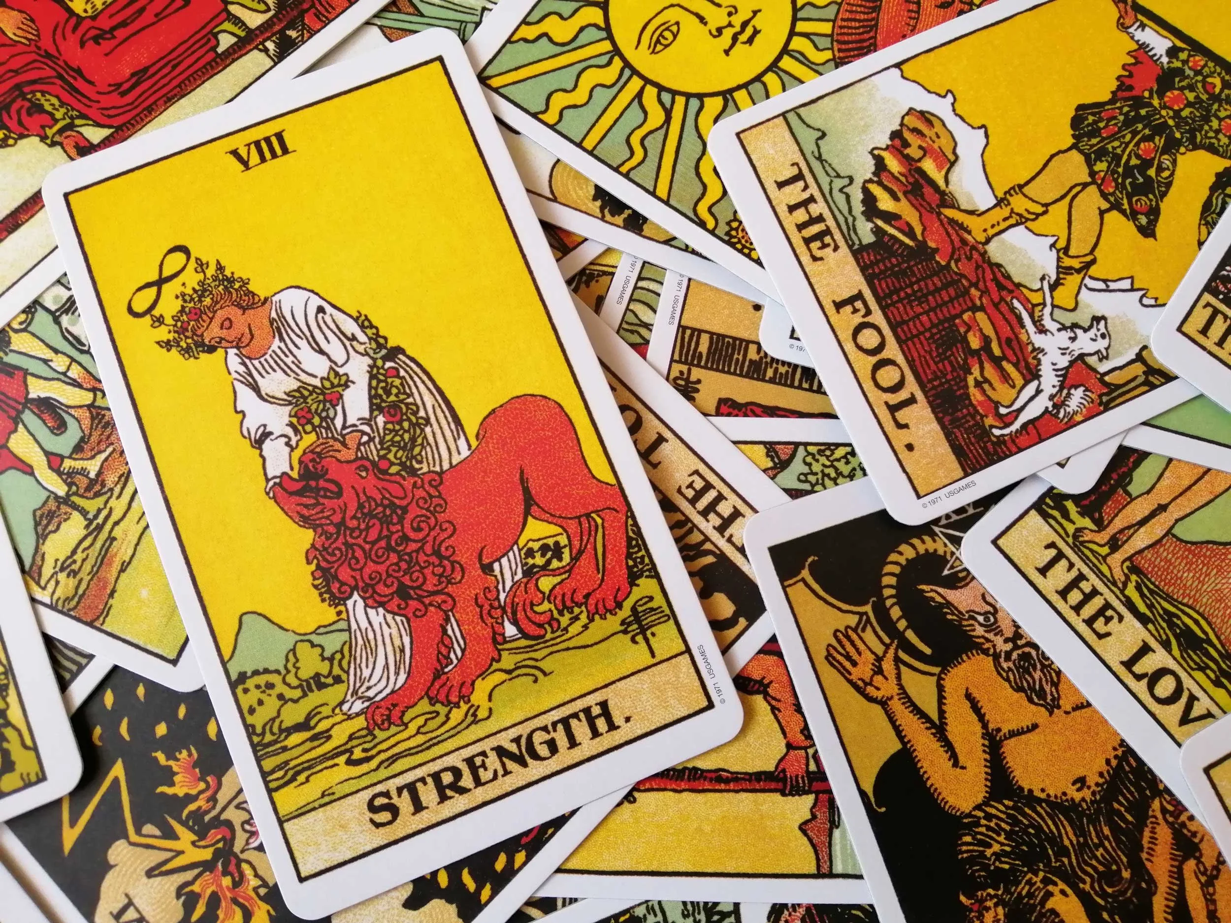 Tarot cards with a focus on Strength.