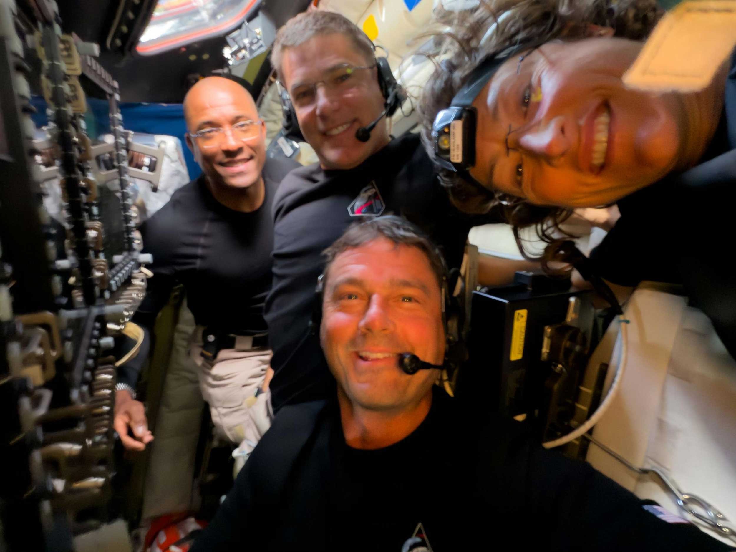 The Artemis II crew poses for a selfie.