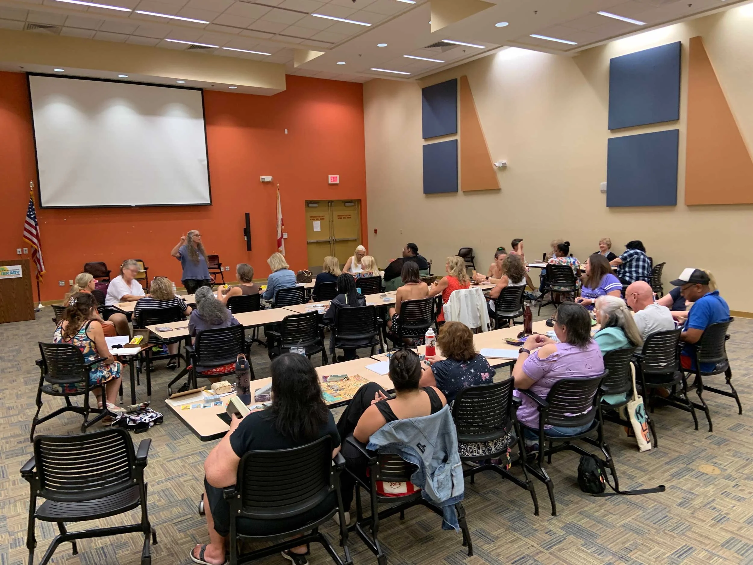 Christiana teaching tarot at a library in Delray Beach, Florida, August 2026.