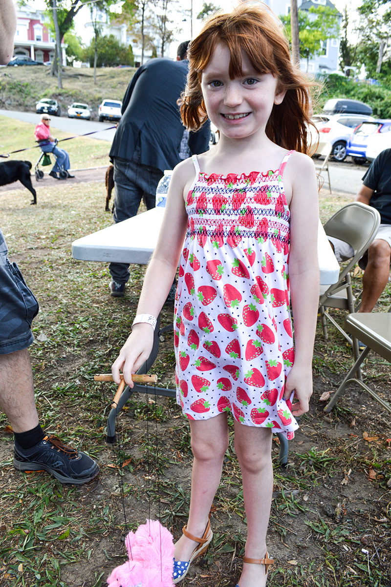 Looks like someone is happy to play with their new puppet purchased from one of our craft vendors