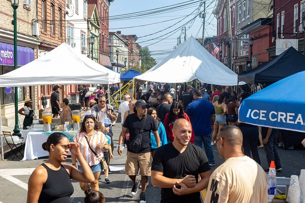 Haverstraw Food Crawl with people enjoying food and drinks on Main Street