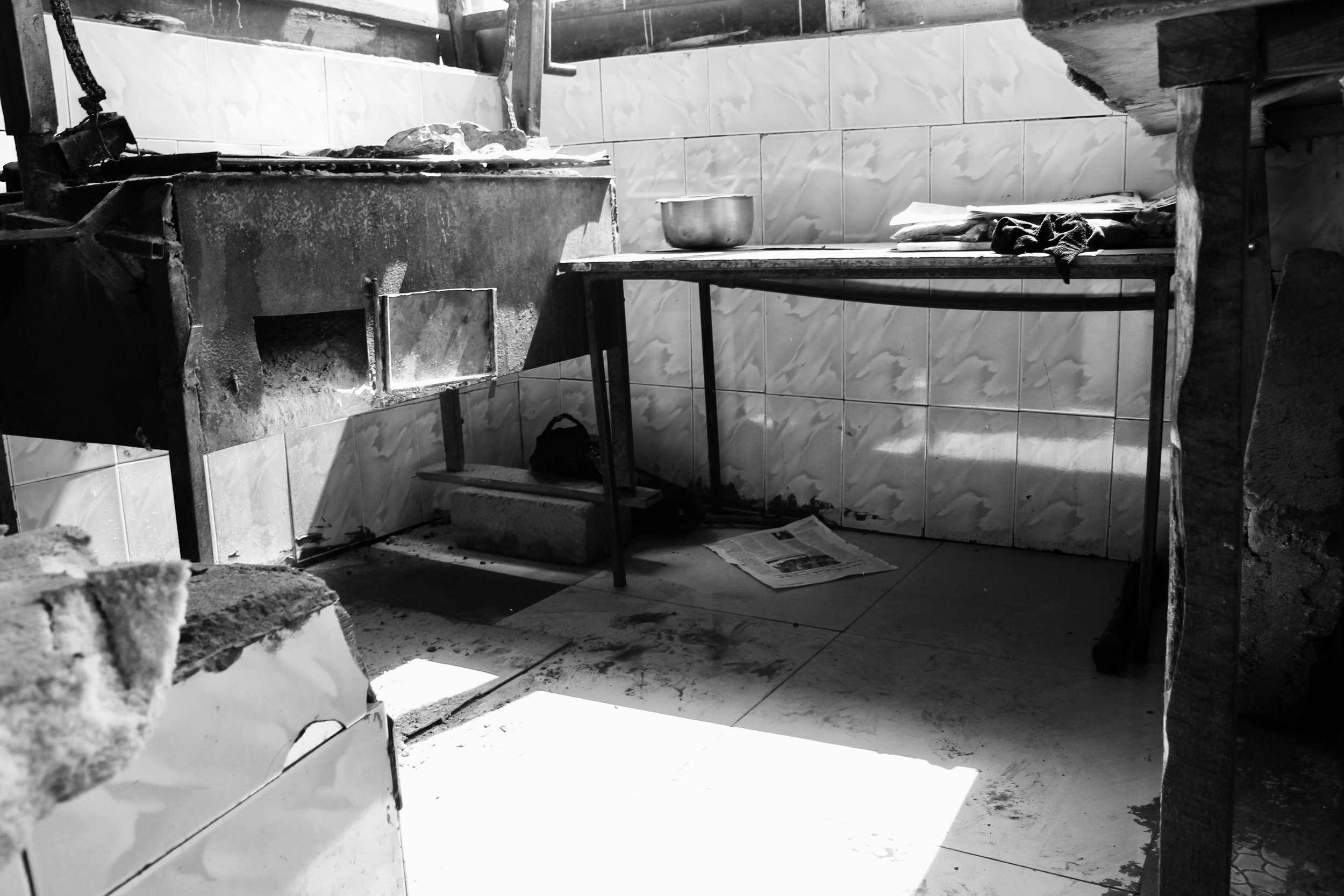 Where some of the street boys sleep. Though it is hard to tell from this photo this area is open air (it is in the outside portion of the butchery).