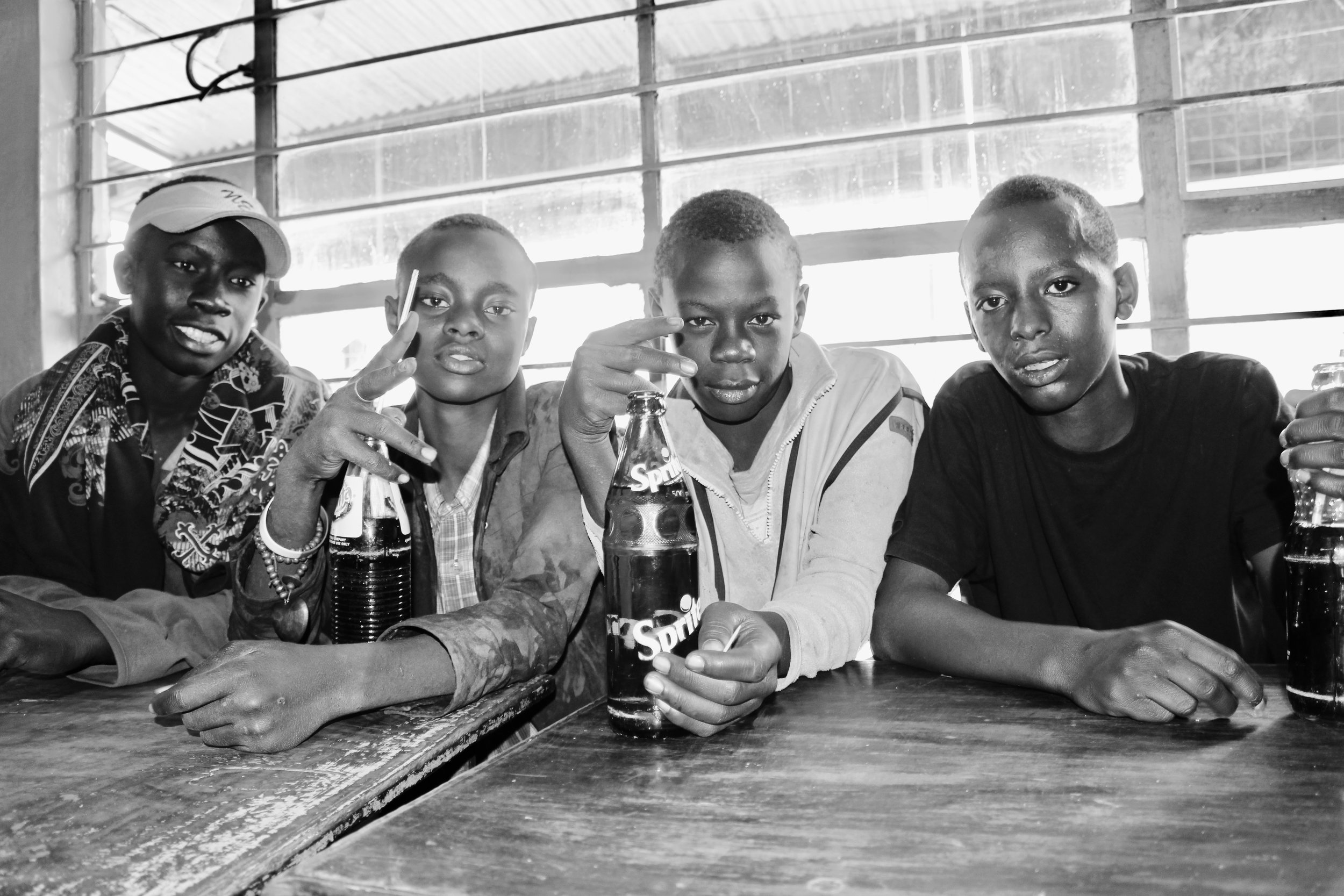 Boniface is on the far right. He is now in my home. The other three (from right to left: Melvin, Cain, and Victor) still sleep at the butchery.