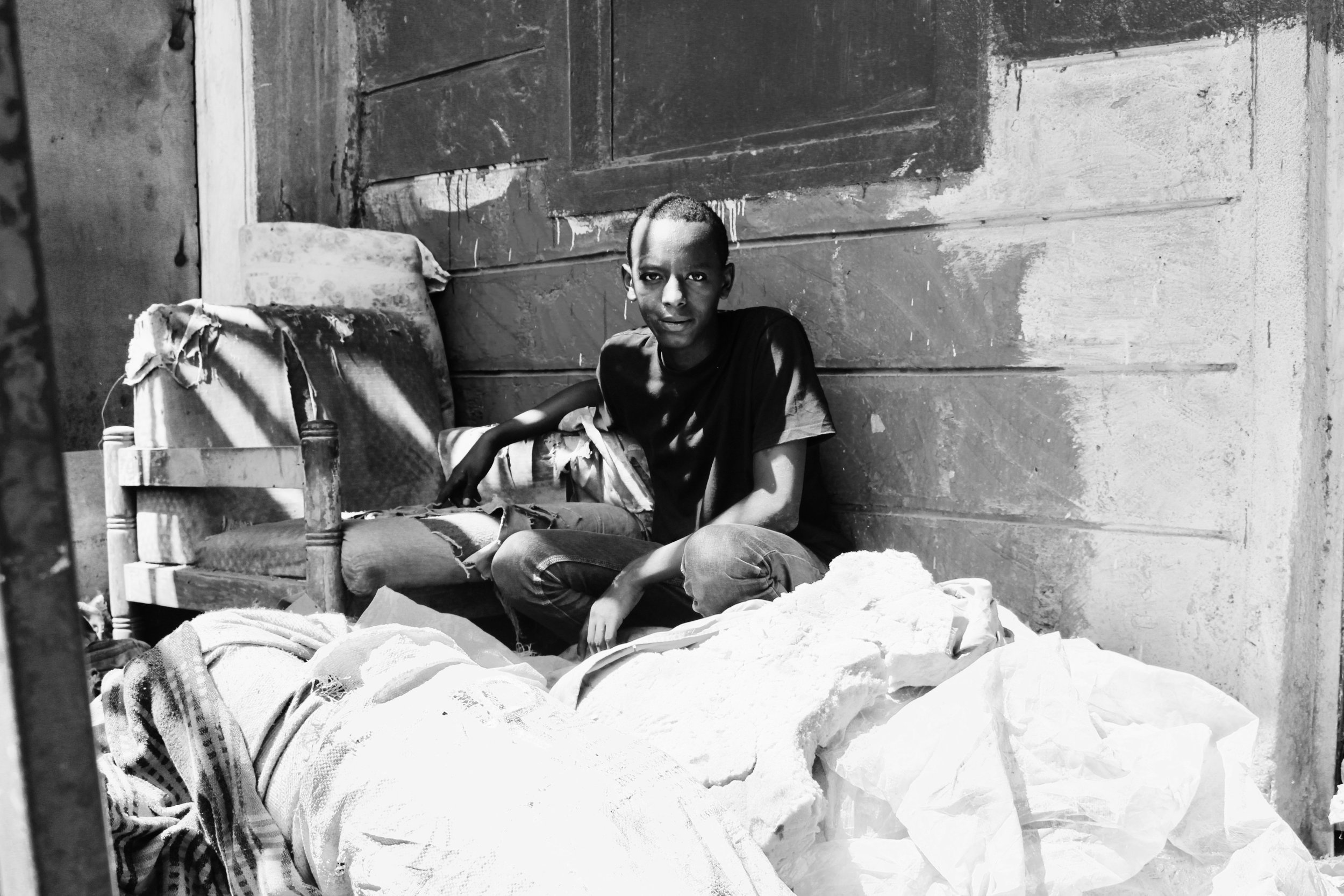 Boniface showing me the base where he used to sleep.