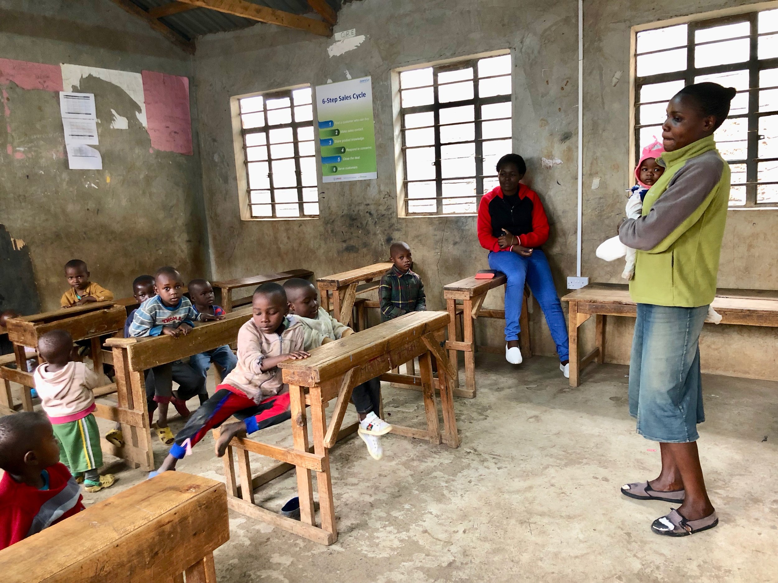 Mama Nancy with some of the kids in the youngest class